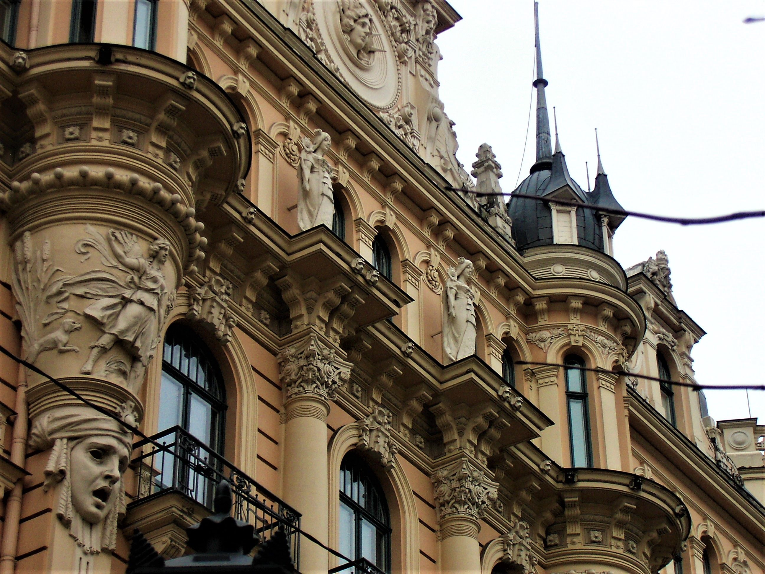 Close up of an art nouveau building with figurines in Riga Close up of an art nouveau building with figurines in Riga