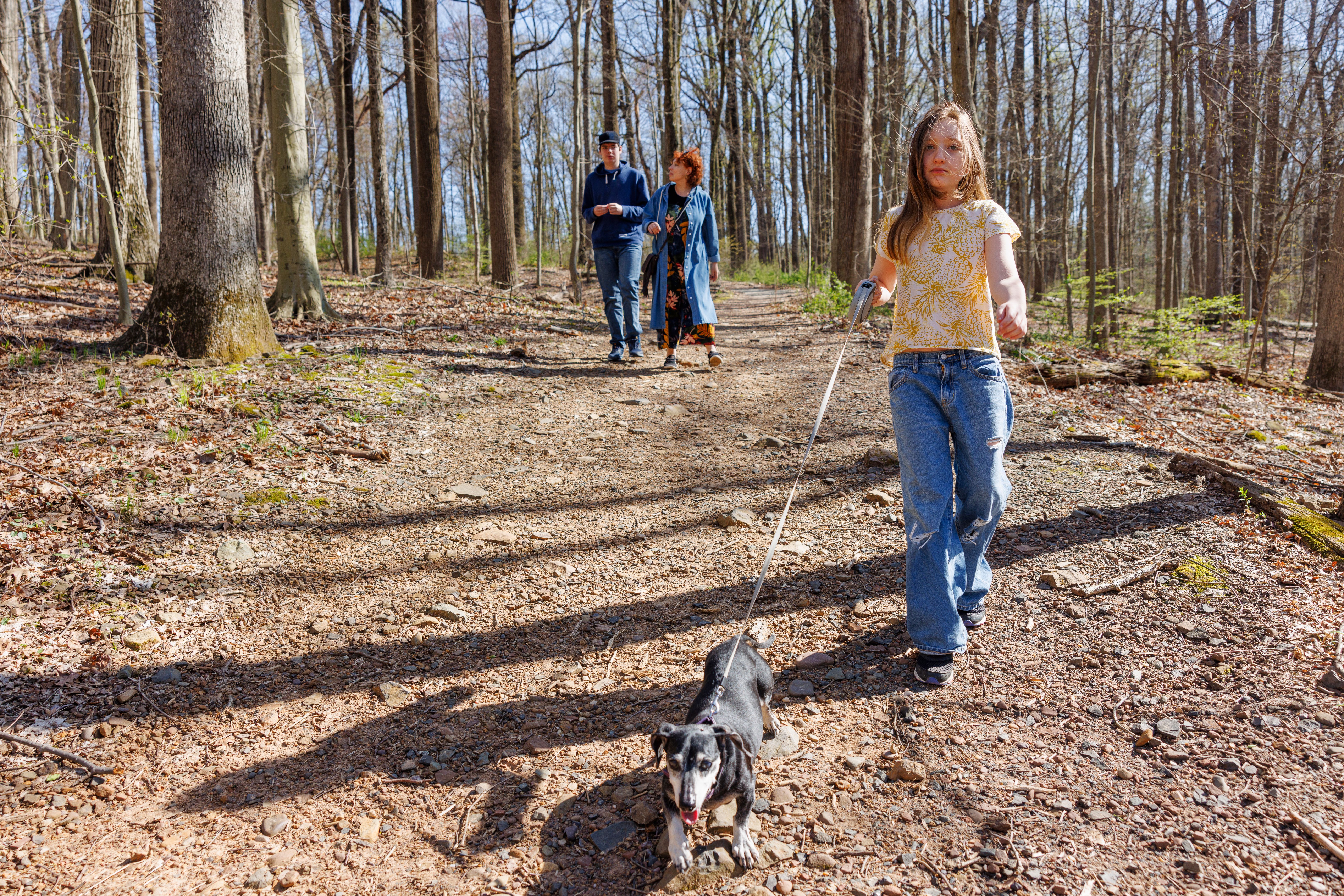 family hiking dog