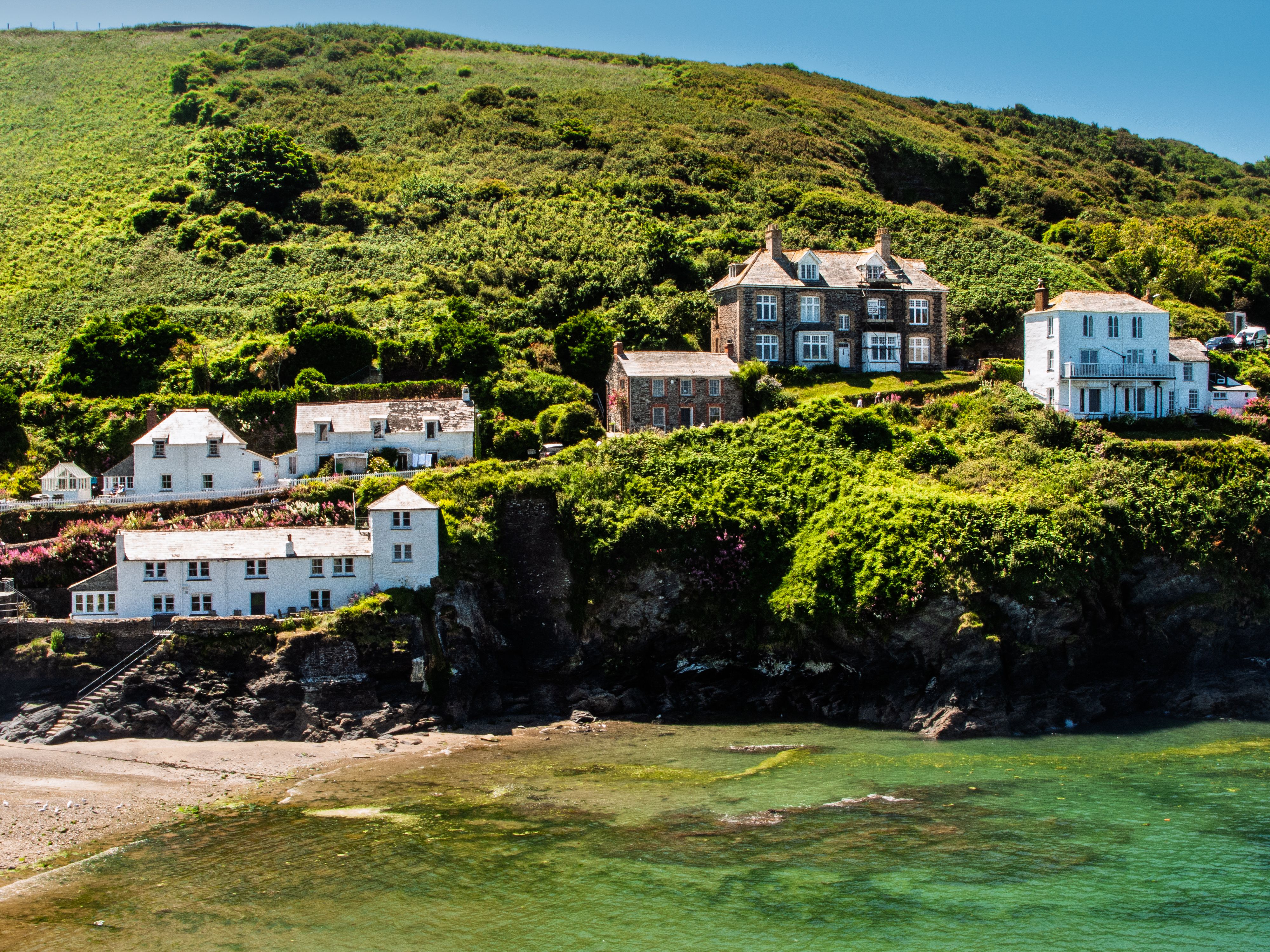Coastal living in a charming seaside village. Houses nestled on a hillside, Doc Martin country