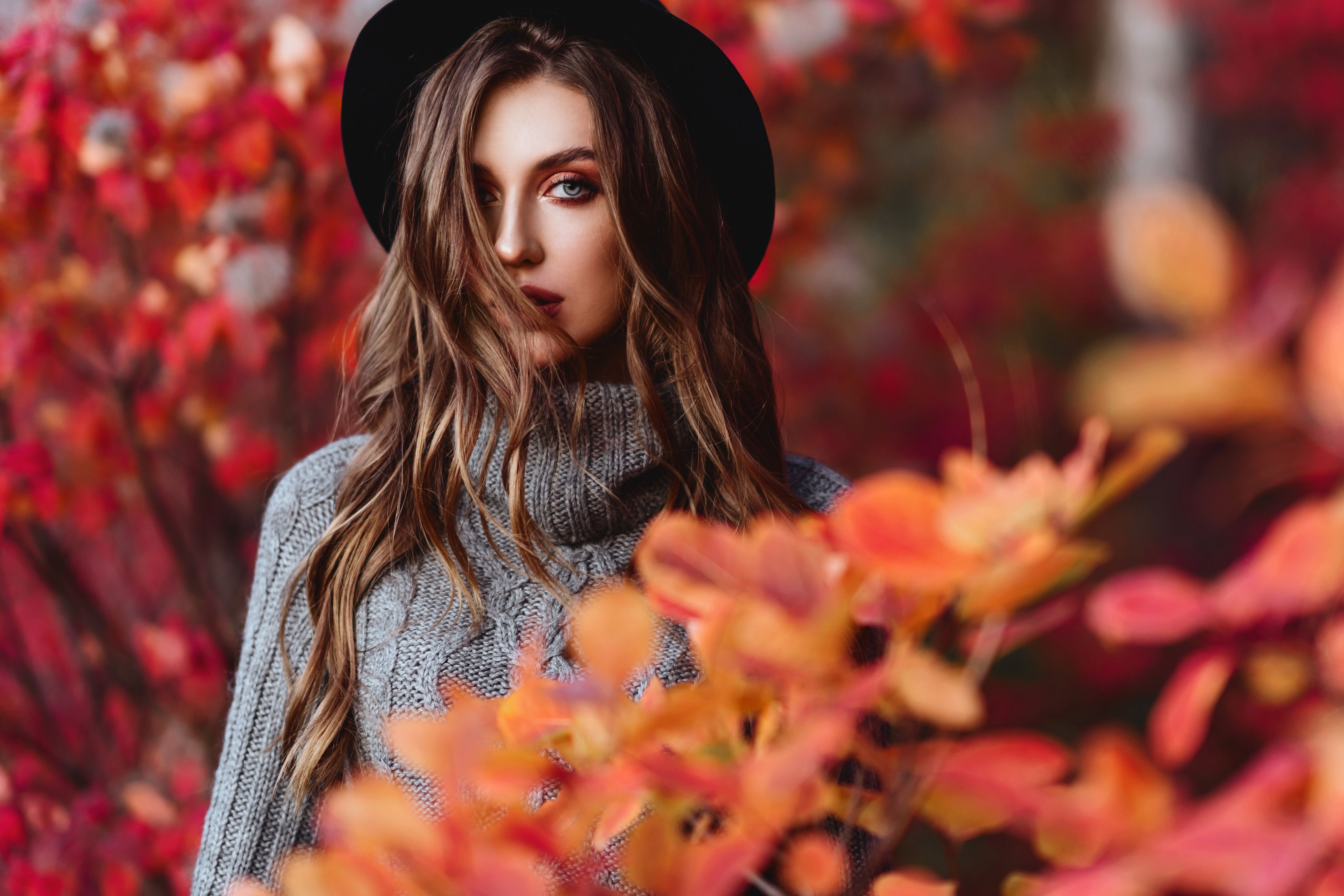 Fashion woman on a background of autumn leaves