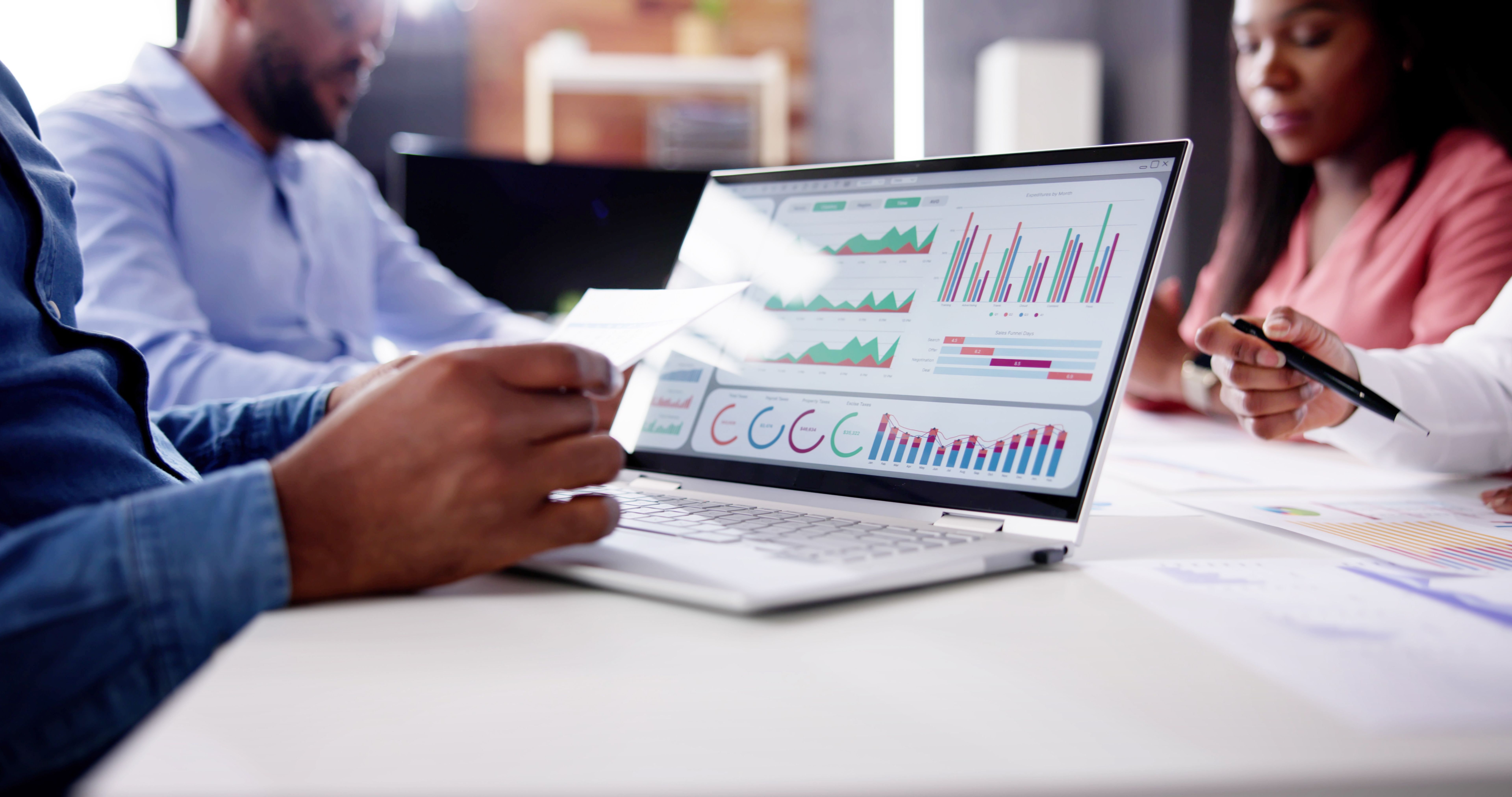 Financial Advisor Group Meeting Examining Analytics