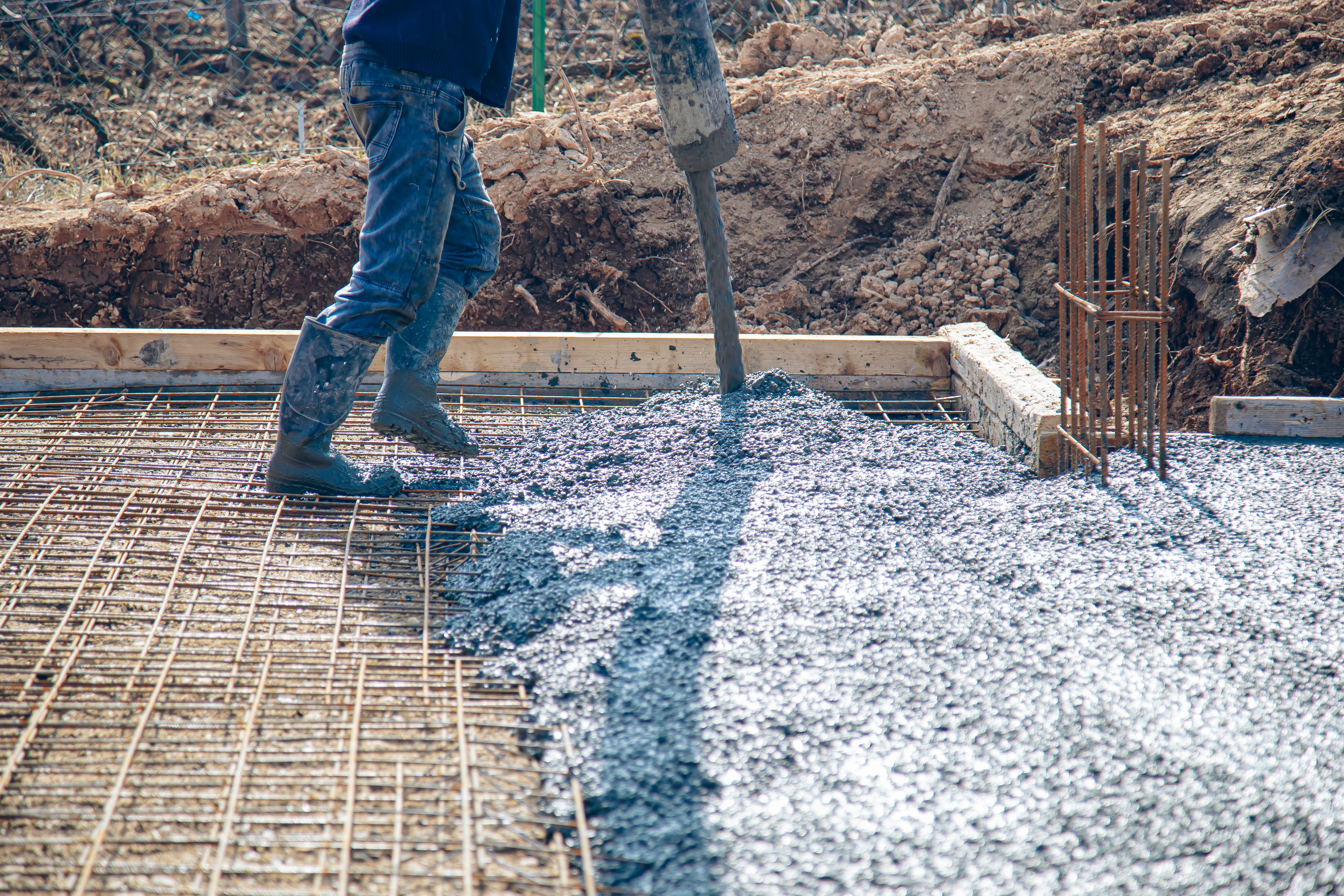 Pouring concrete in preset rebar mesh with concrete pump