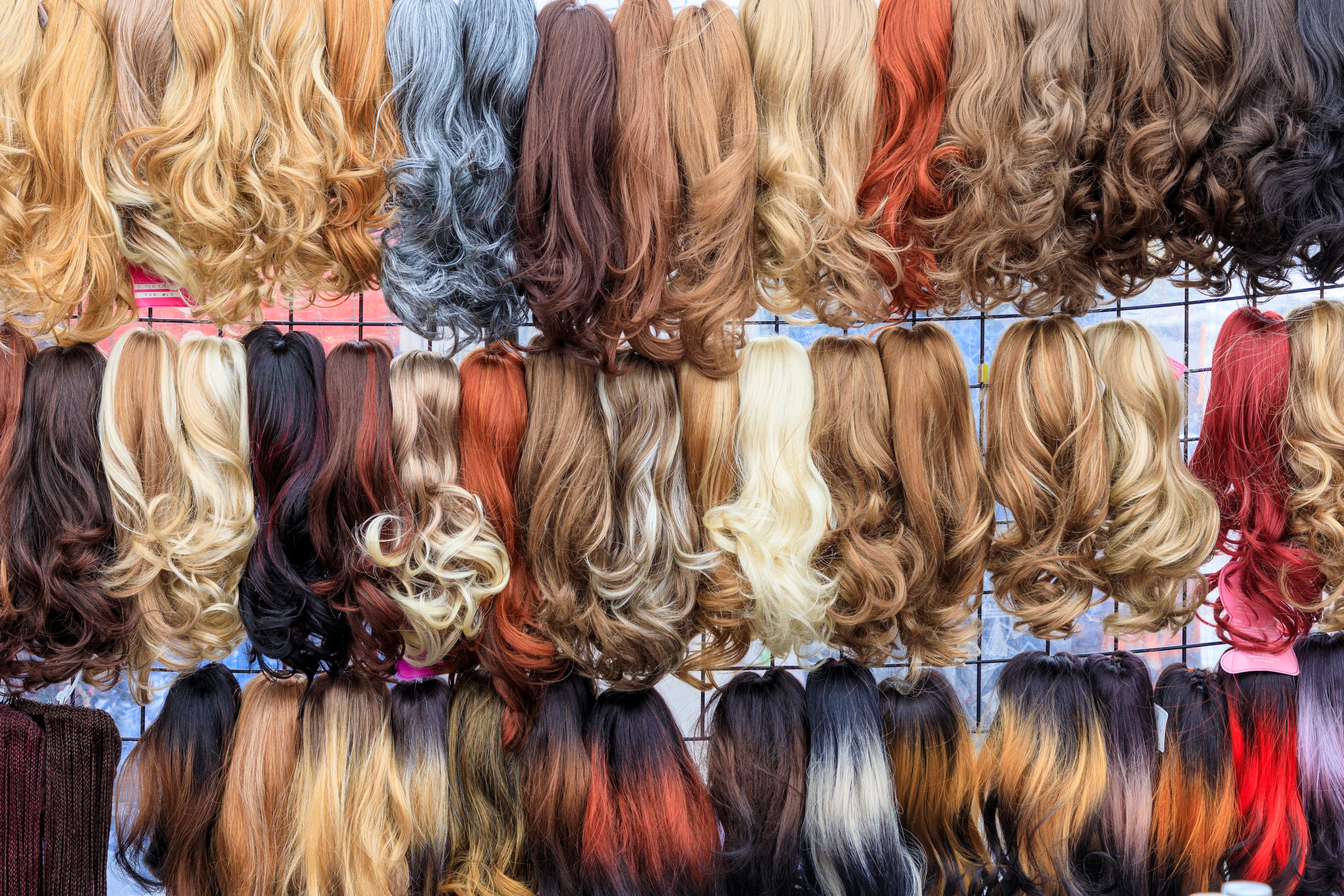 Europe, The Netherlands, Holland. Oud Zuid Amsterdam. Street market. Wigs for sale.