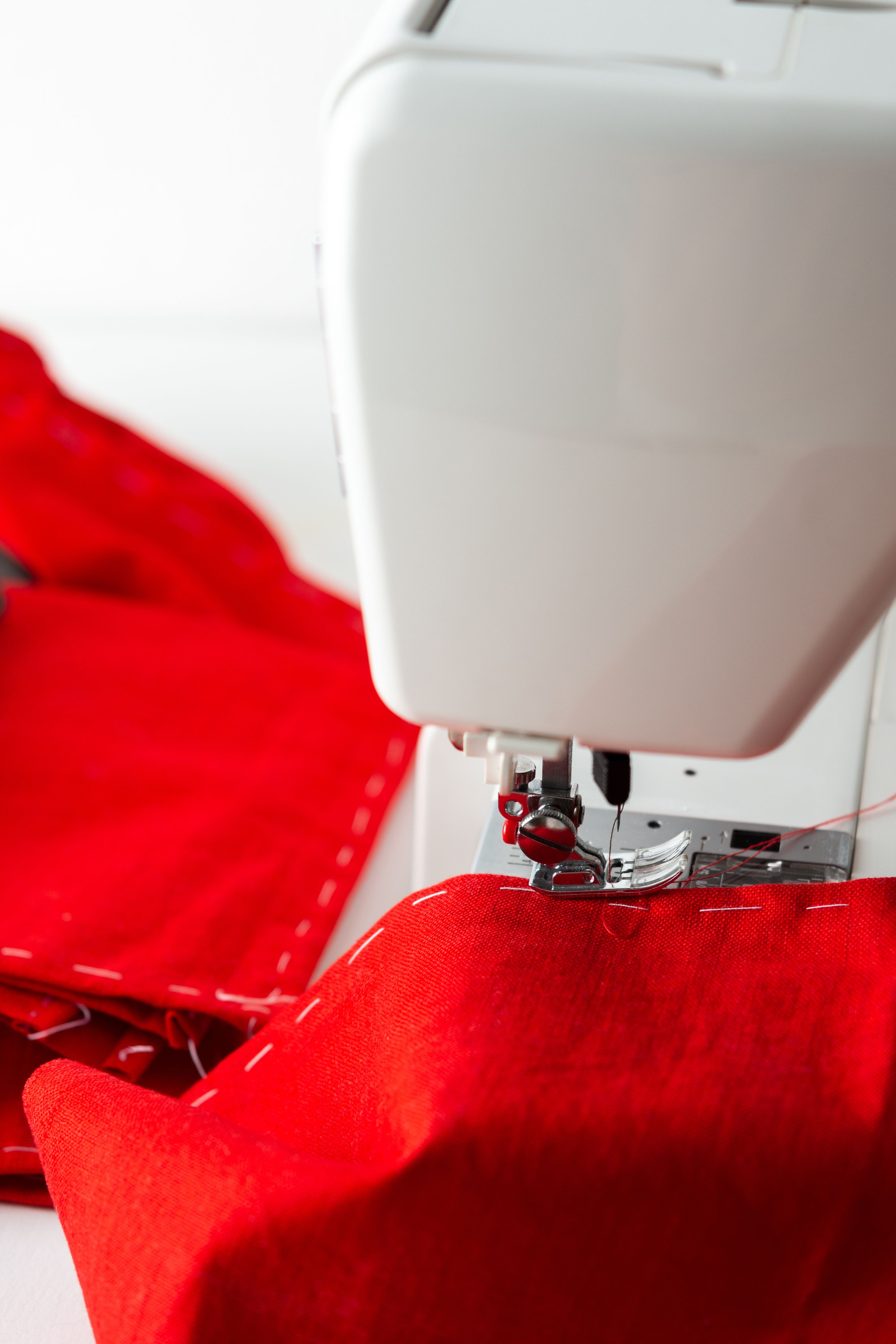 Sewing machine with red fabric