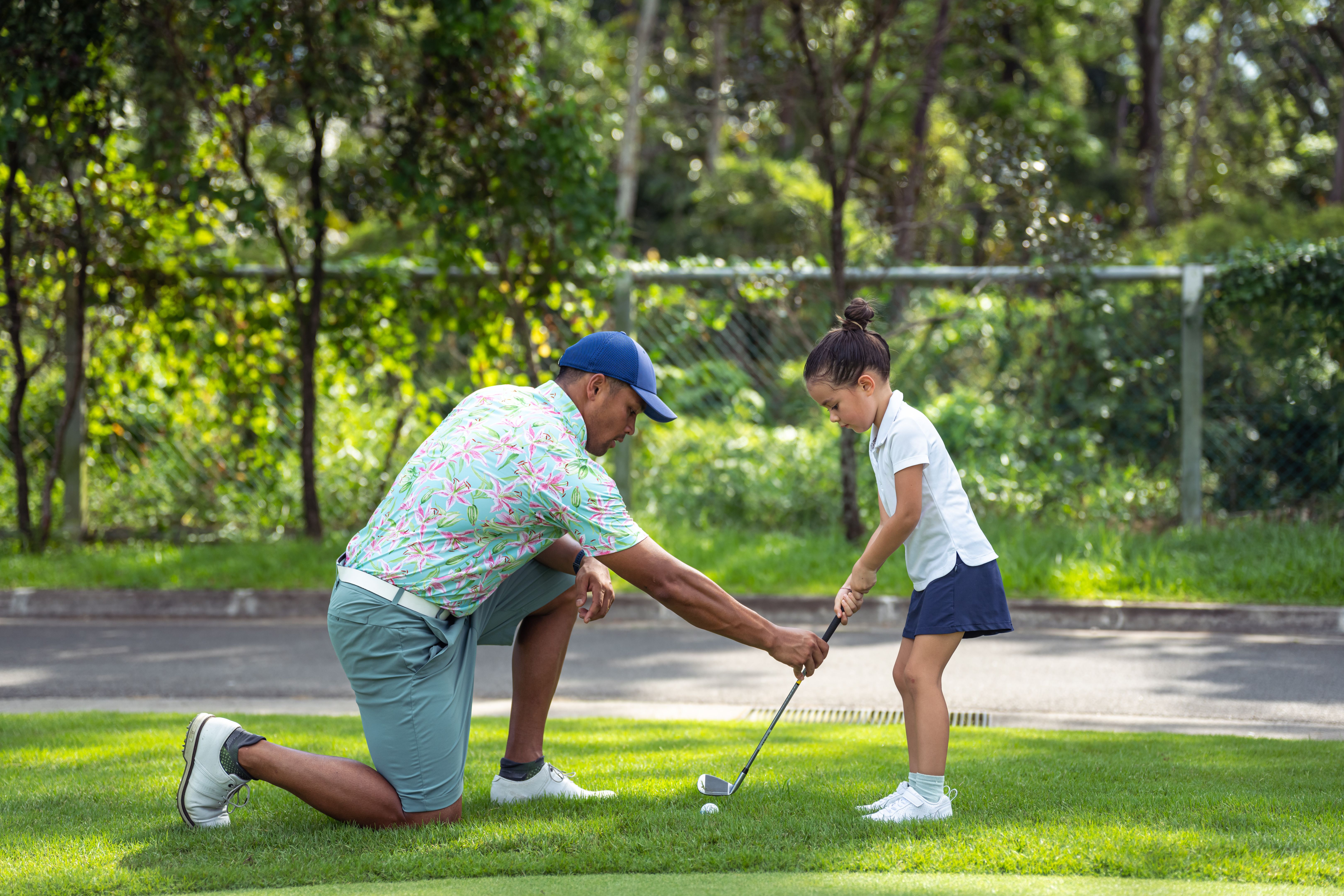 students playing golf