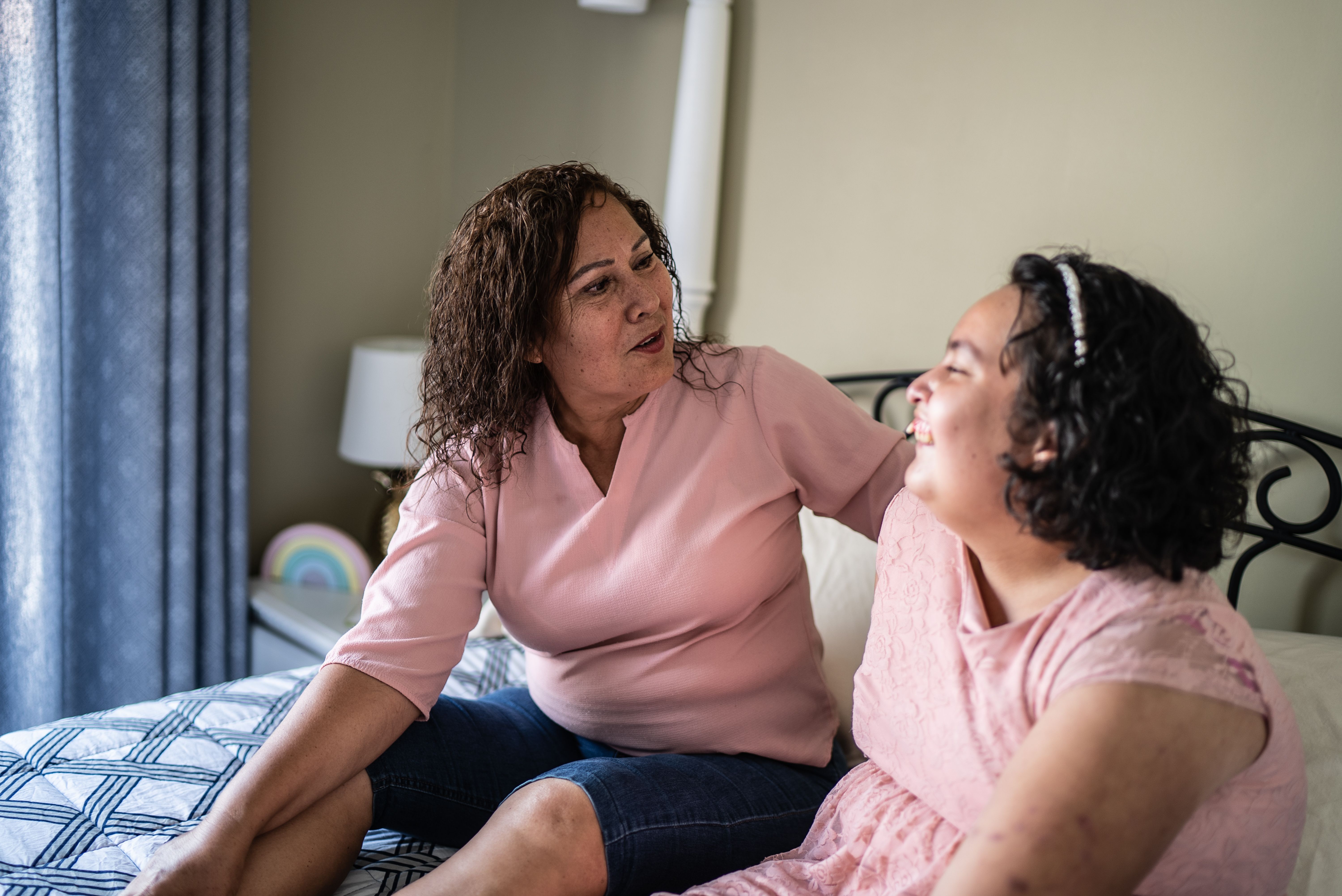 Mother and psychomotor Intellectual disability daughter talking at home