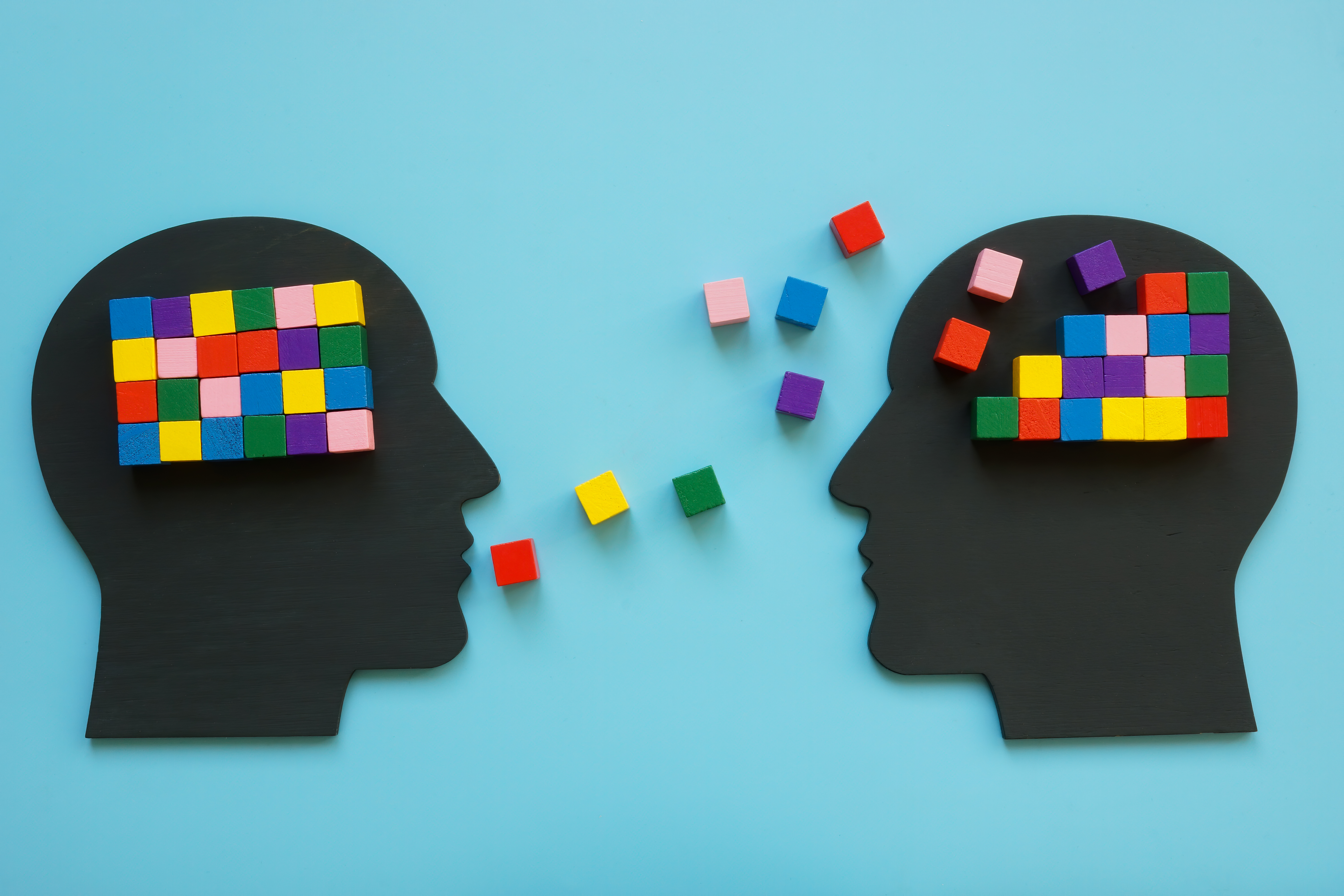 Heads with colorful cubes as symbol of mentoring and psychotherapy. Heads with colorful cubes as symbol of mentoring and psychotherapy.