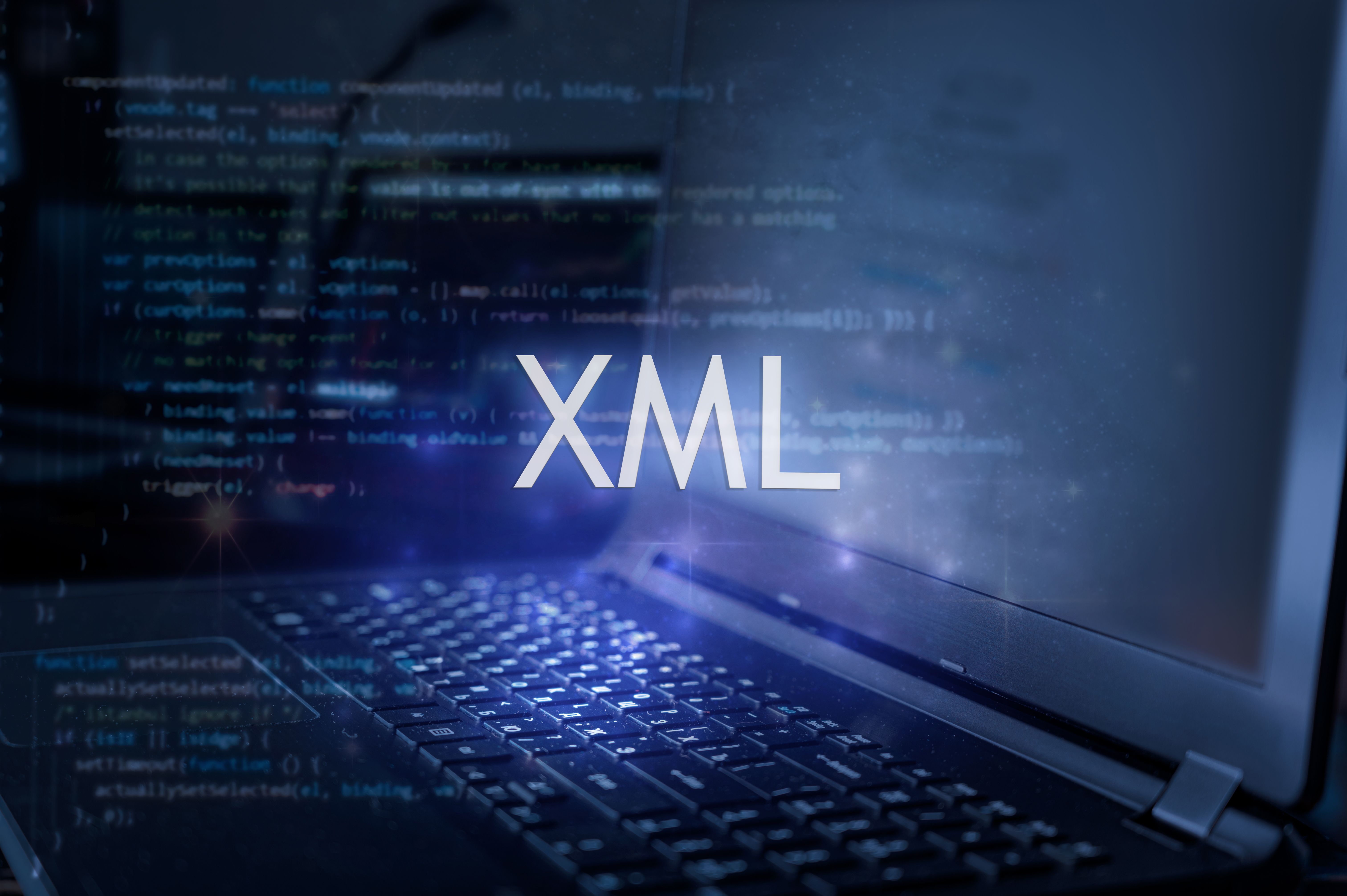 XML inscription against laptop and code background.