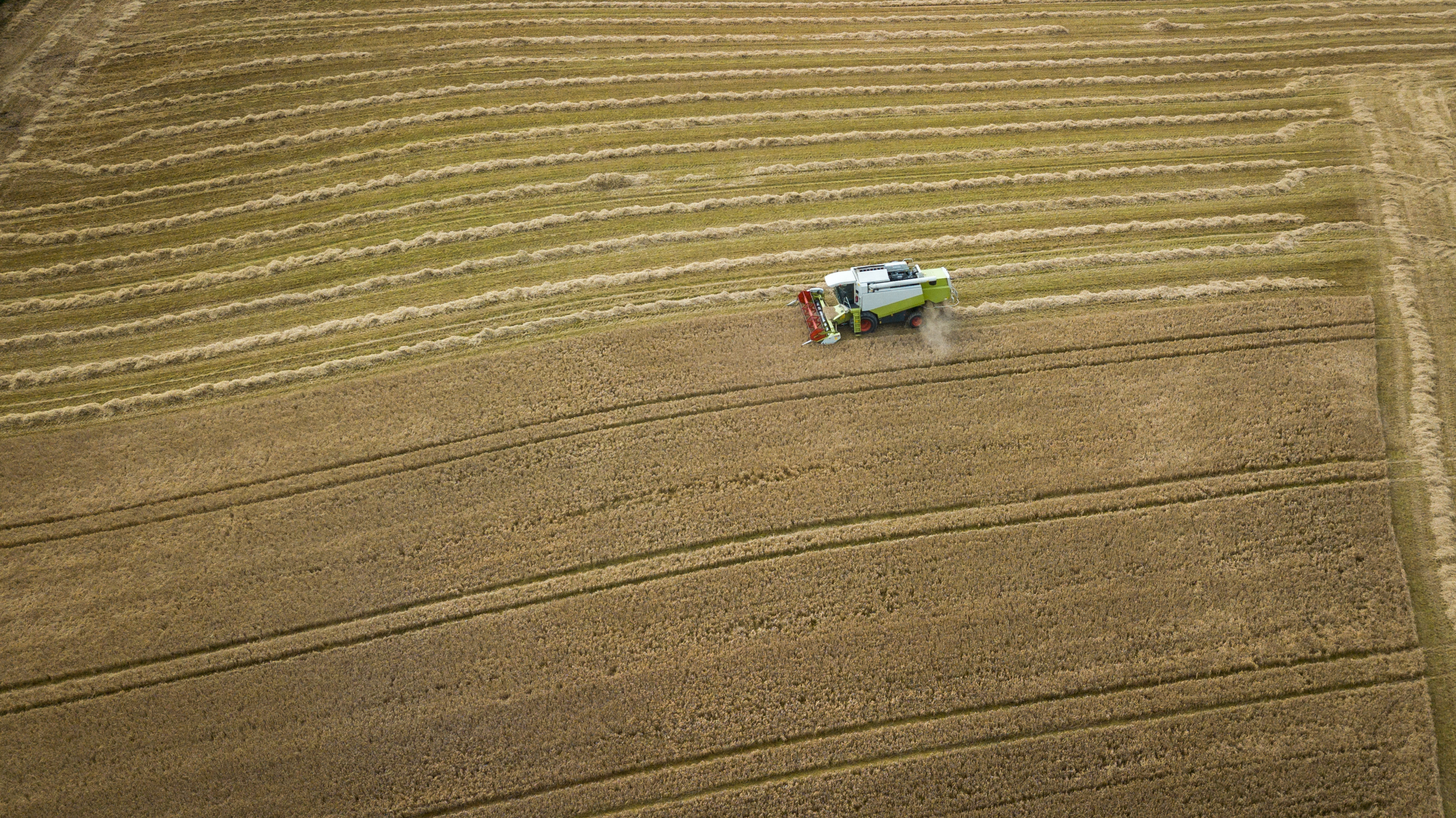 Aerial View of Combine Harvester at Work in a Field, County Wicklow Aerial View of Combine Harvester at Work in a Field, County Wicklow