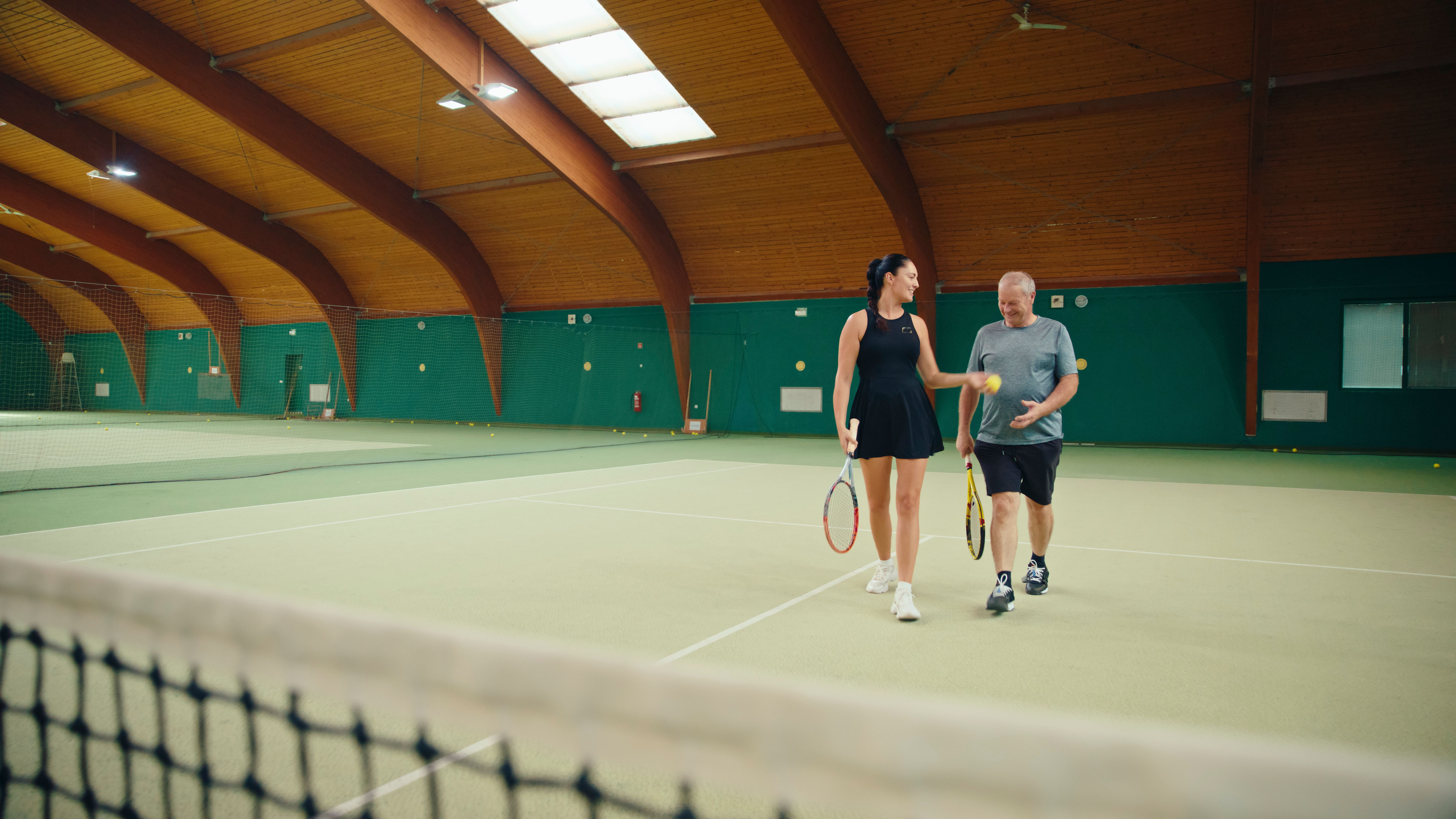 older adults playing tennis