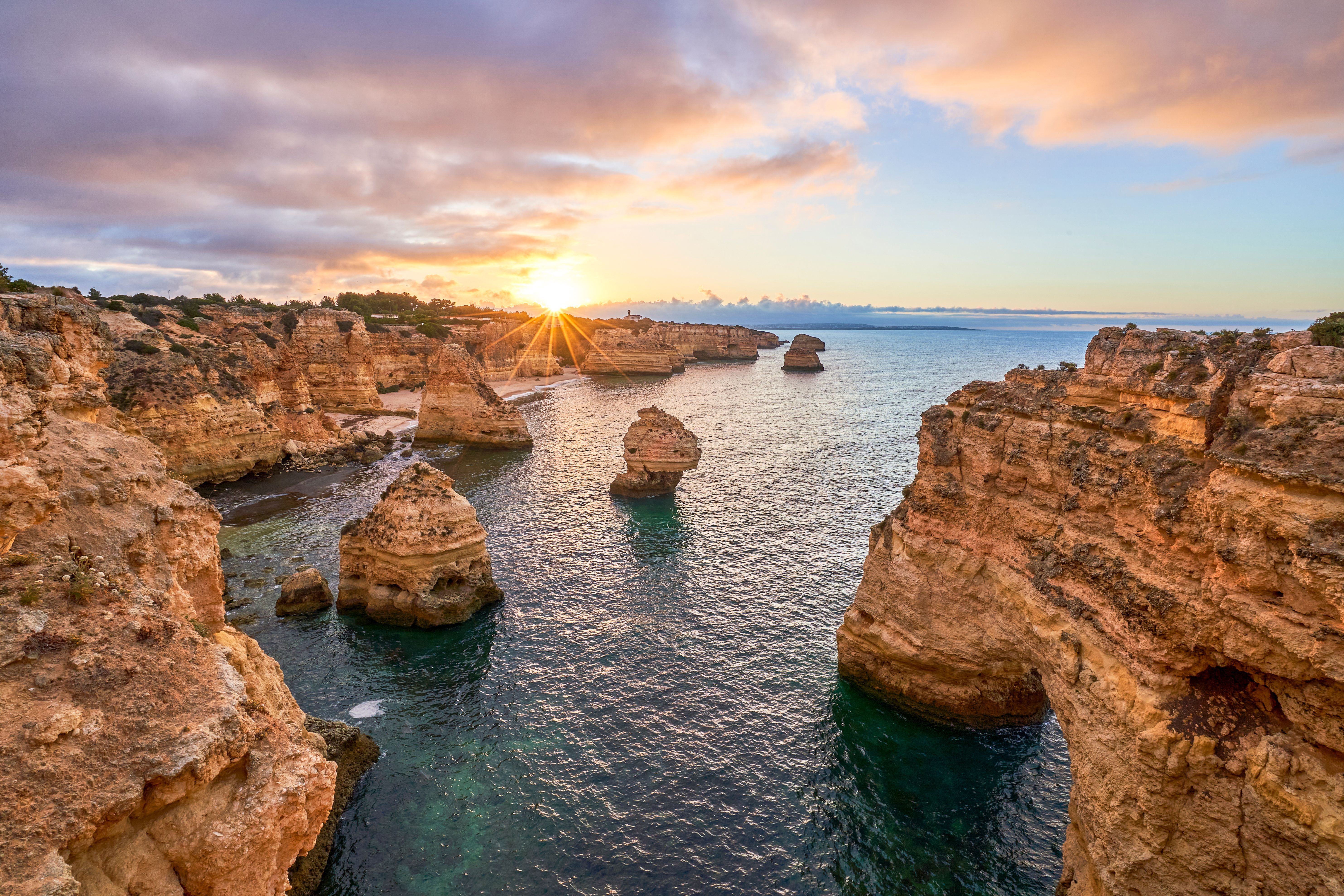 Sunrise at Praia da Marinha's Rocky Cliffs Along the Famous Algarve Coast in Southern Portugal, Europe