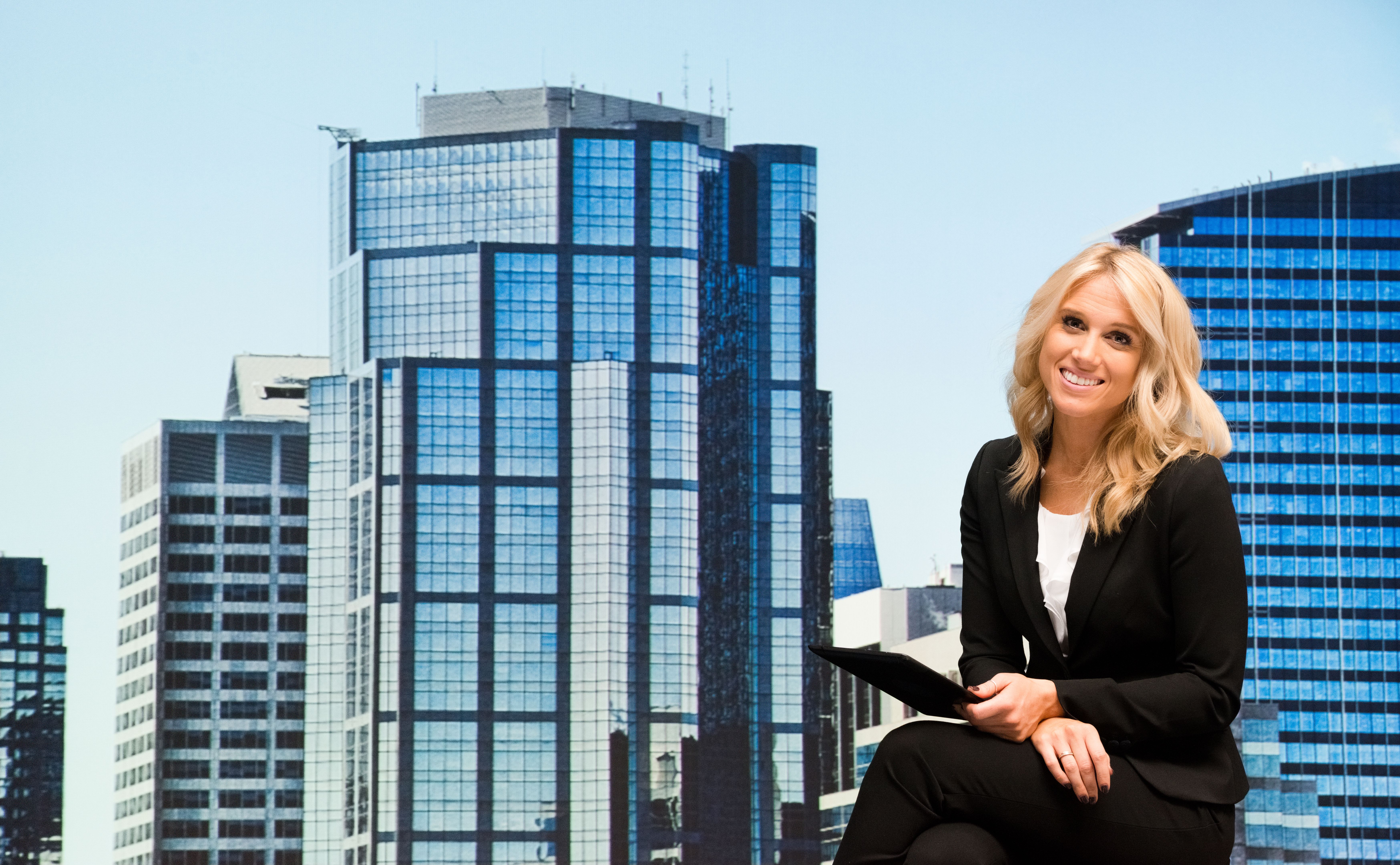 Smiling businesswoman using tablet outdoors Smiling businesswoman using tablet outdoors