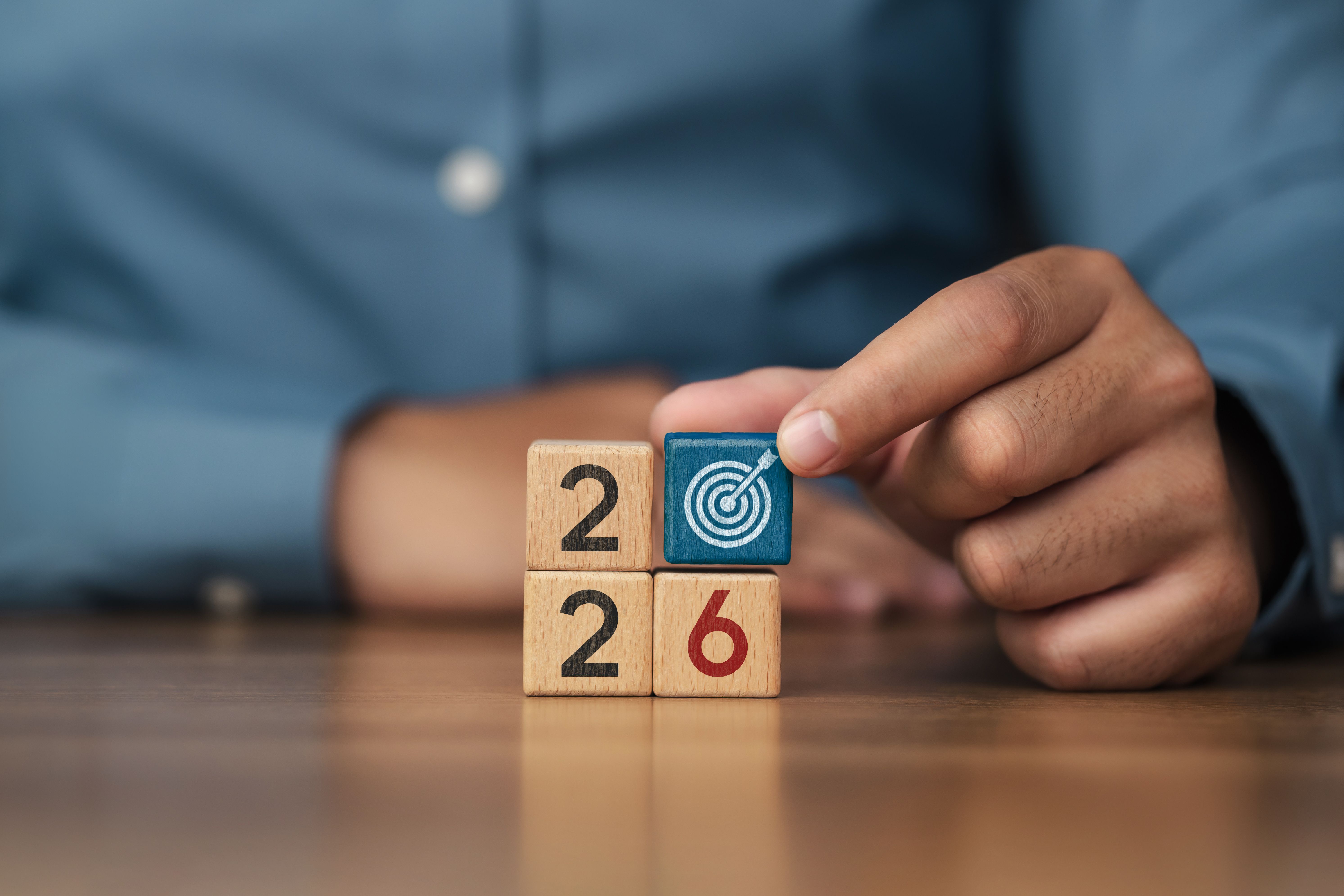 Business goal concept for 2026. With wooden blocks with numbers and goal icons. business strategy action plan Setting goals and future success