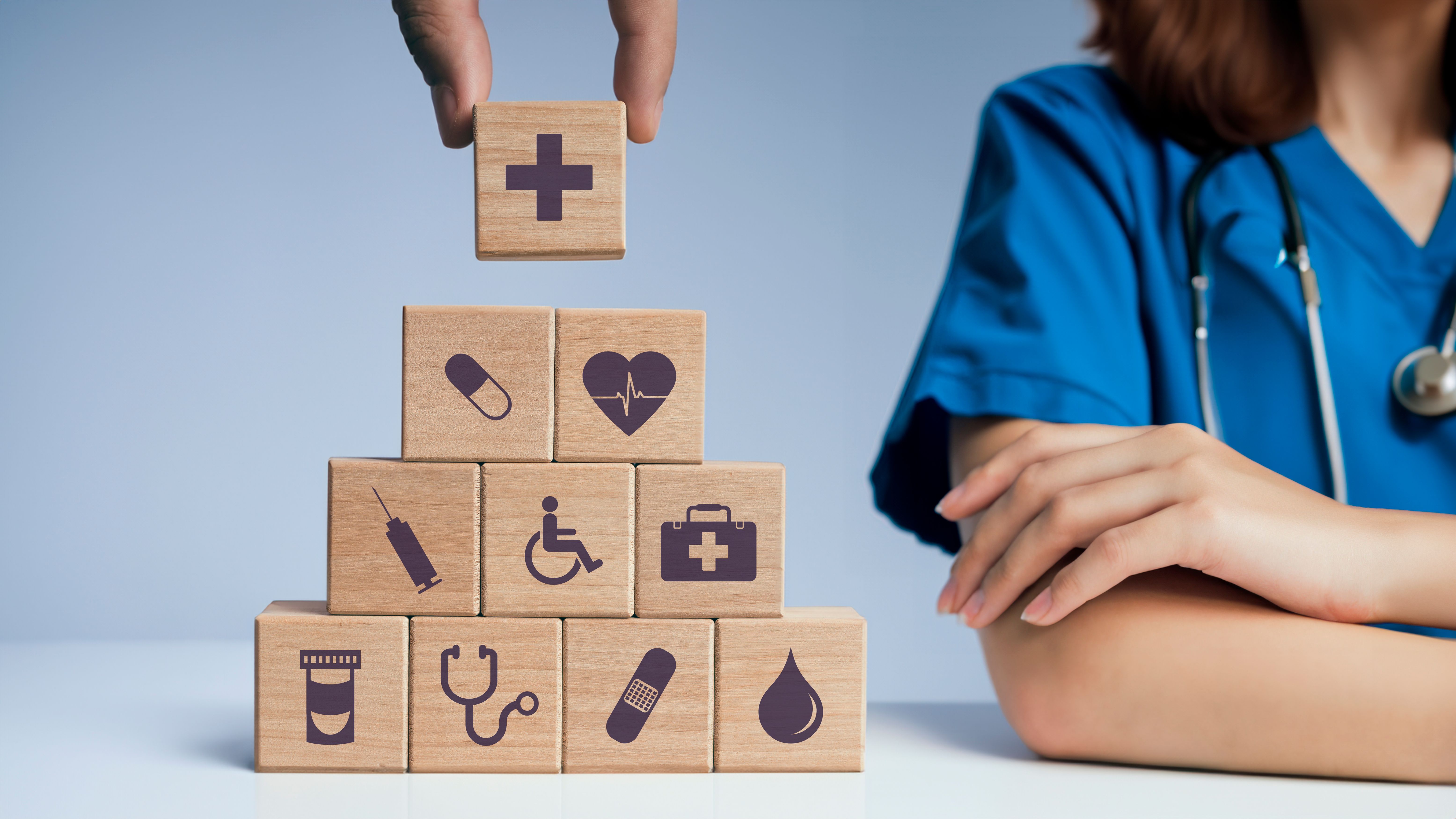 Concept of Insurance for your health, Hand hold wooden block with icon health care medical