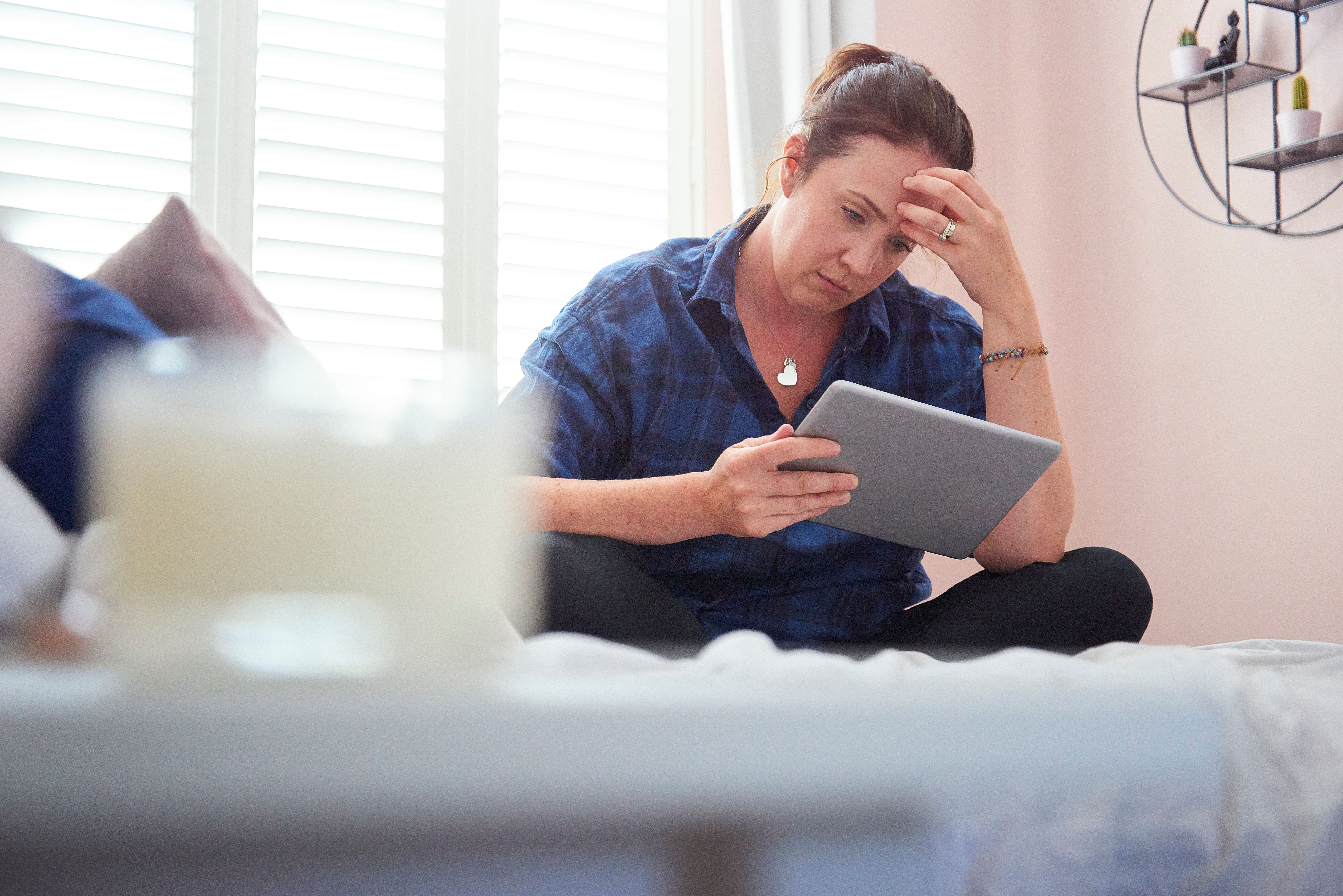 Young woman struggling with bills