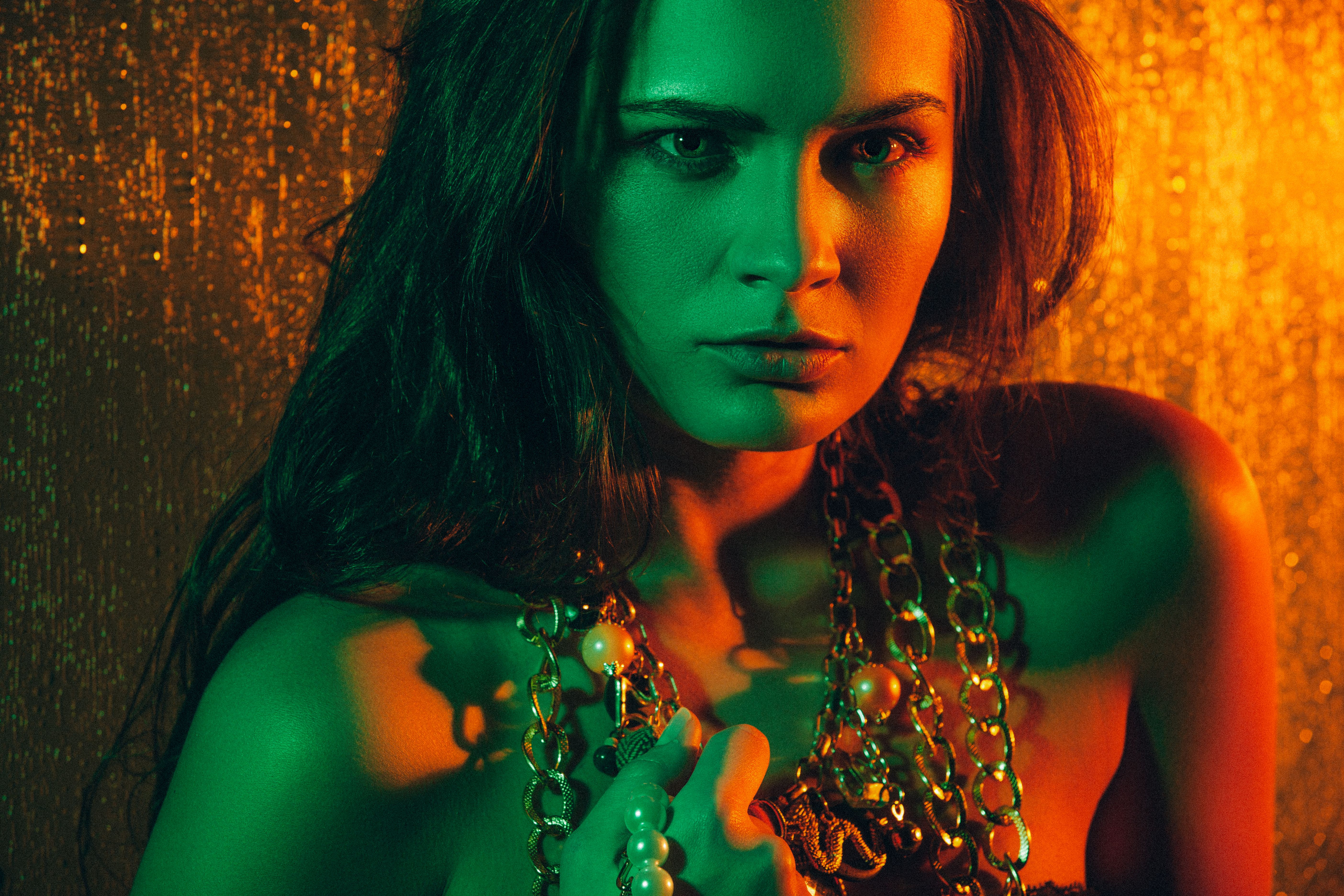 Beauty portrait of beautiful female model on an orange background.