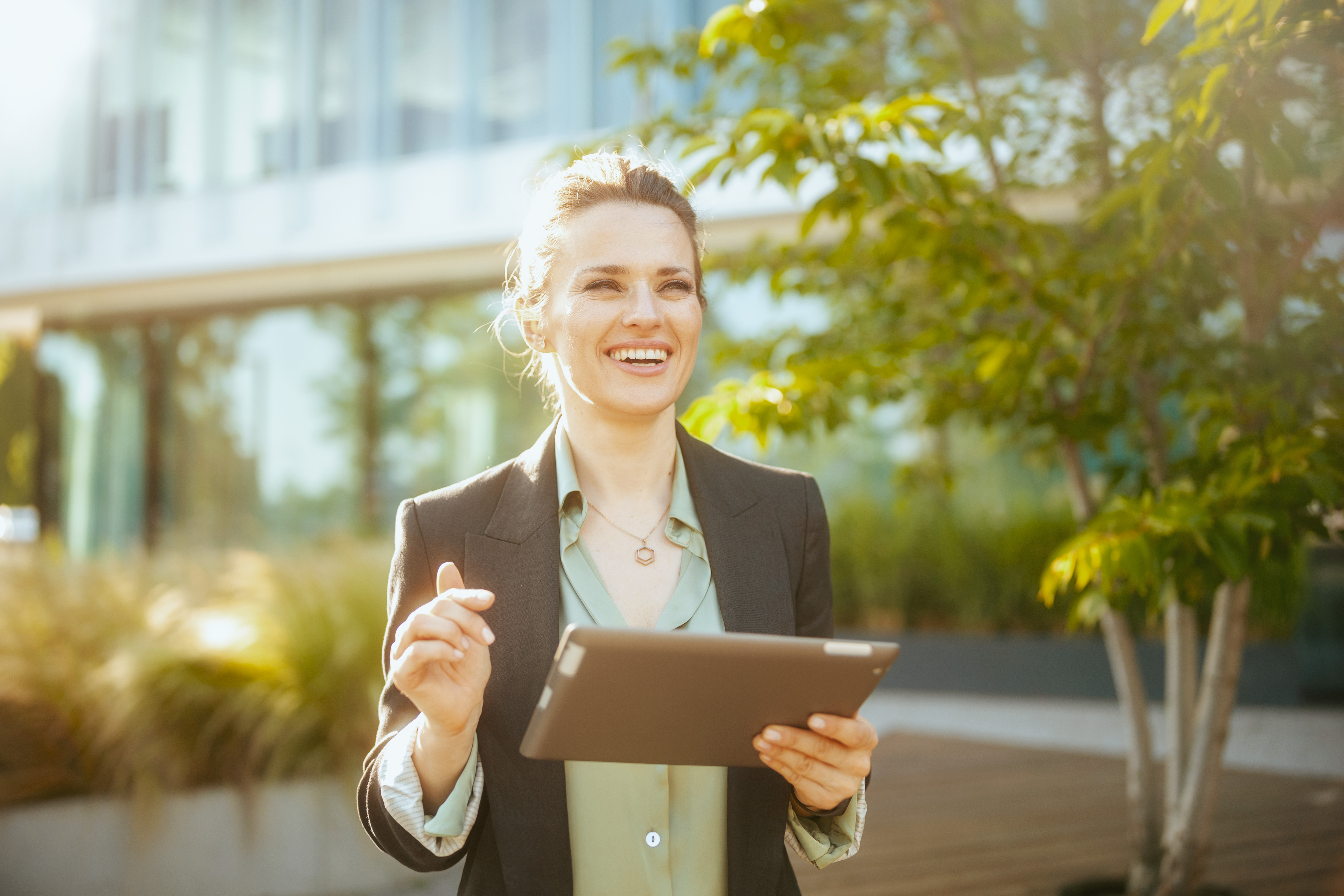 smiling woman worker near office building smiling woman worker near office building