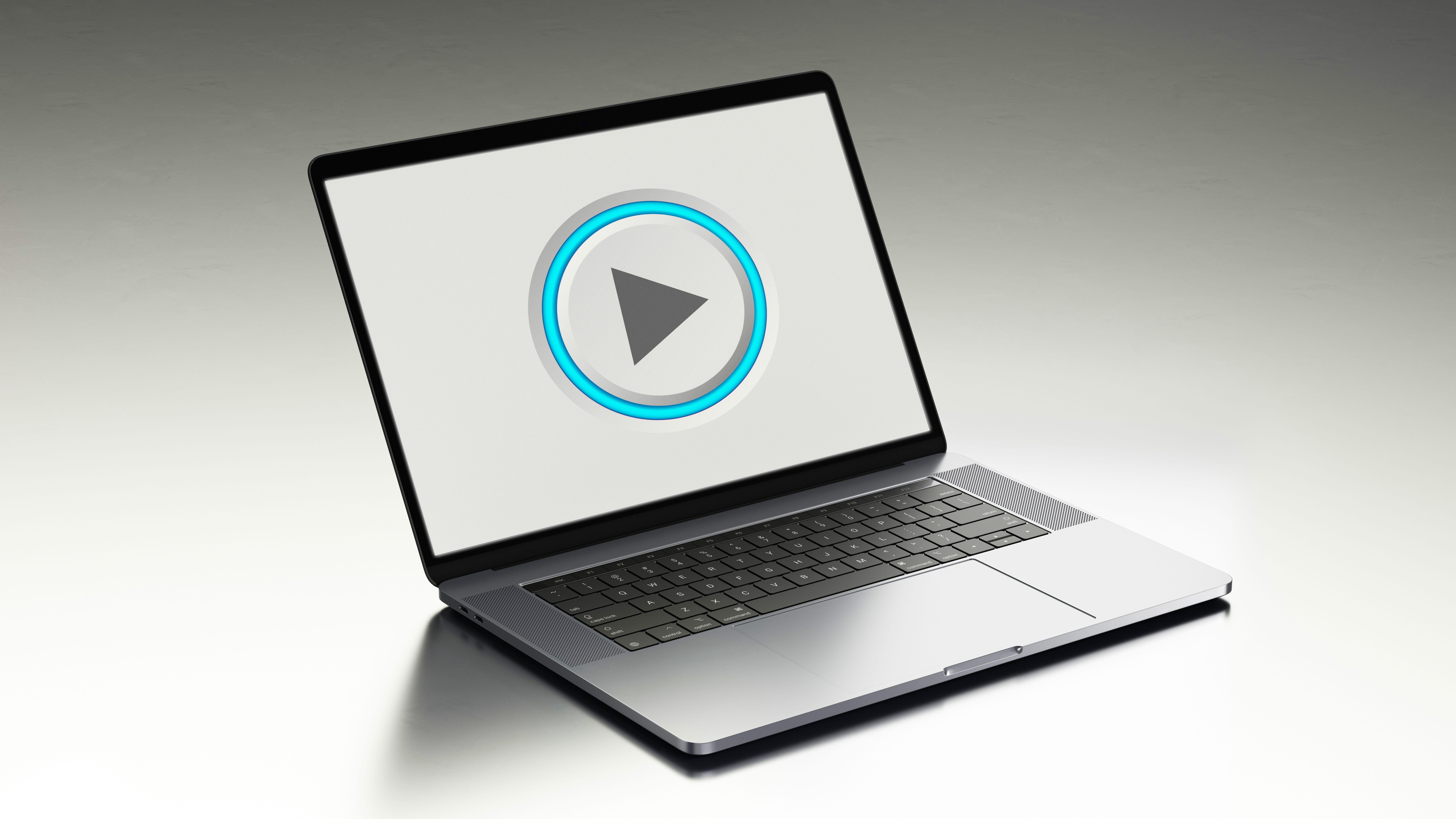 Laptop Play Button: Digital Media Streaming Concept