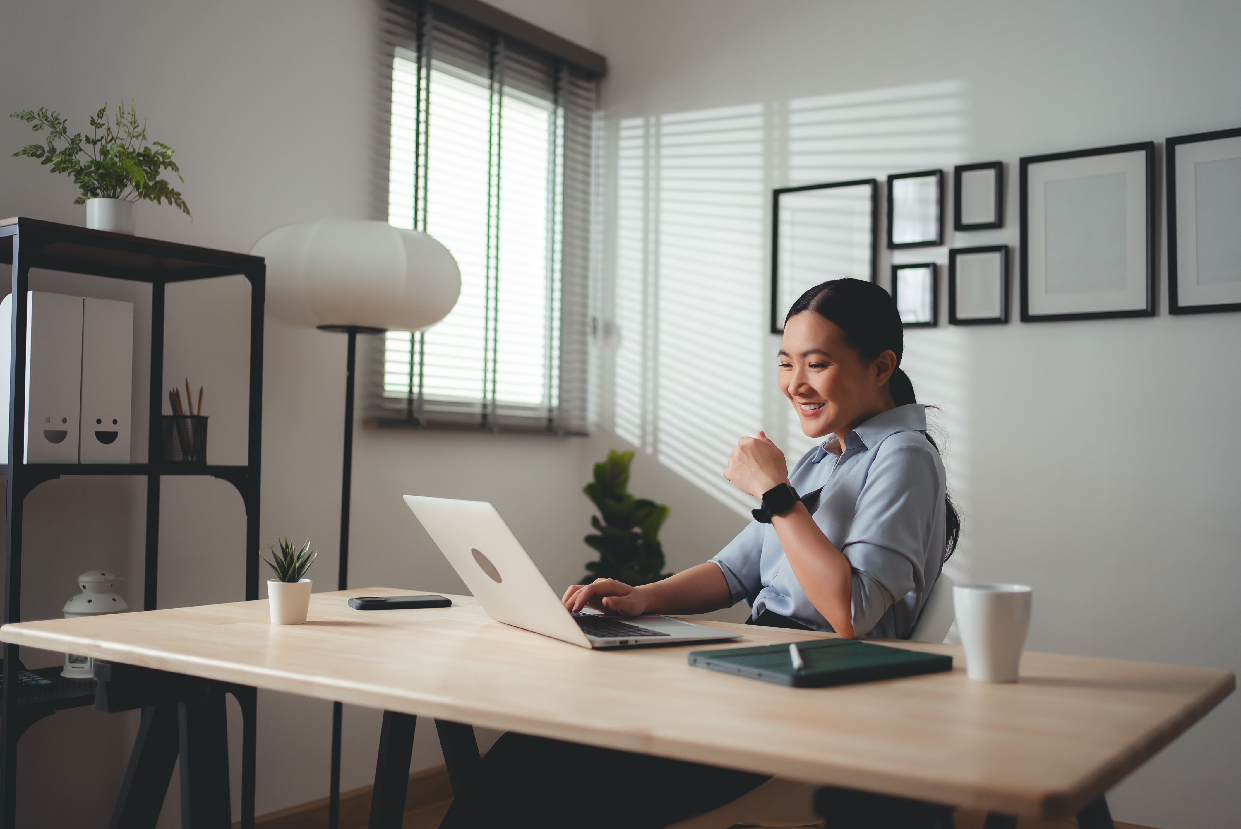 Asian woman enjoy with working online using laptop sitting at home office. Asian woman enjoy with working online using laptop sitting at home office.