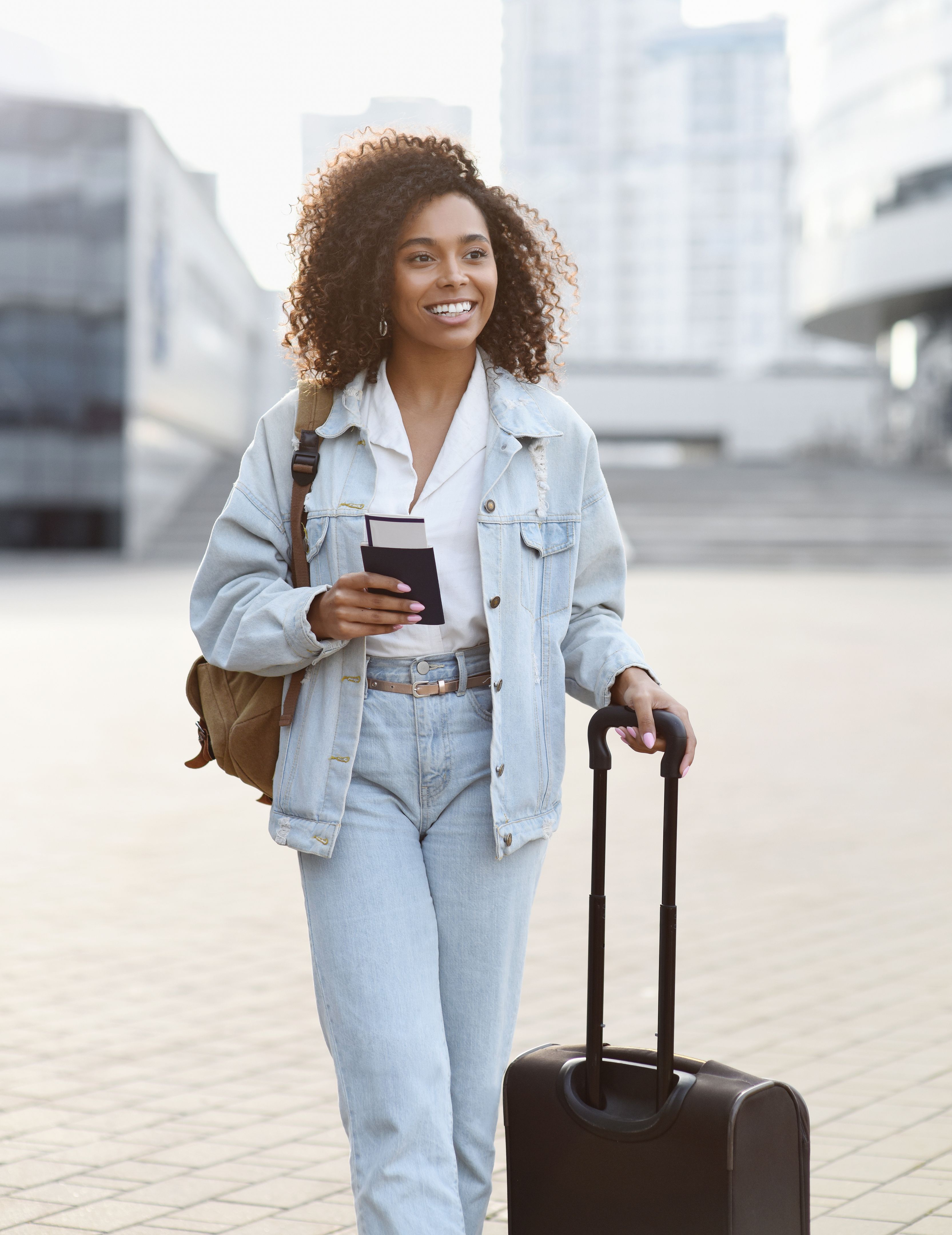 Young woman tourist in a city, traveler girl portrait
