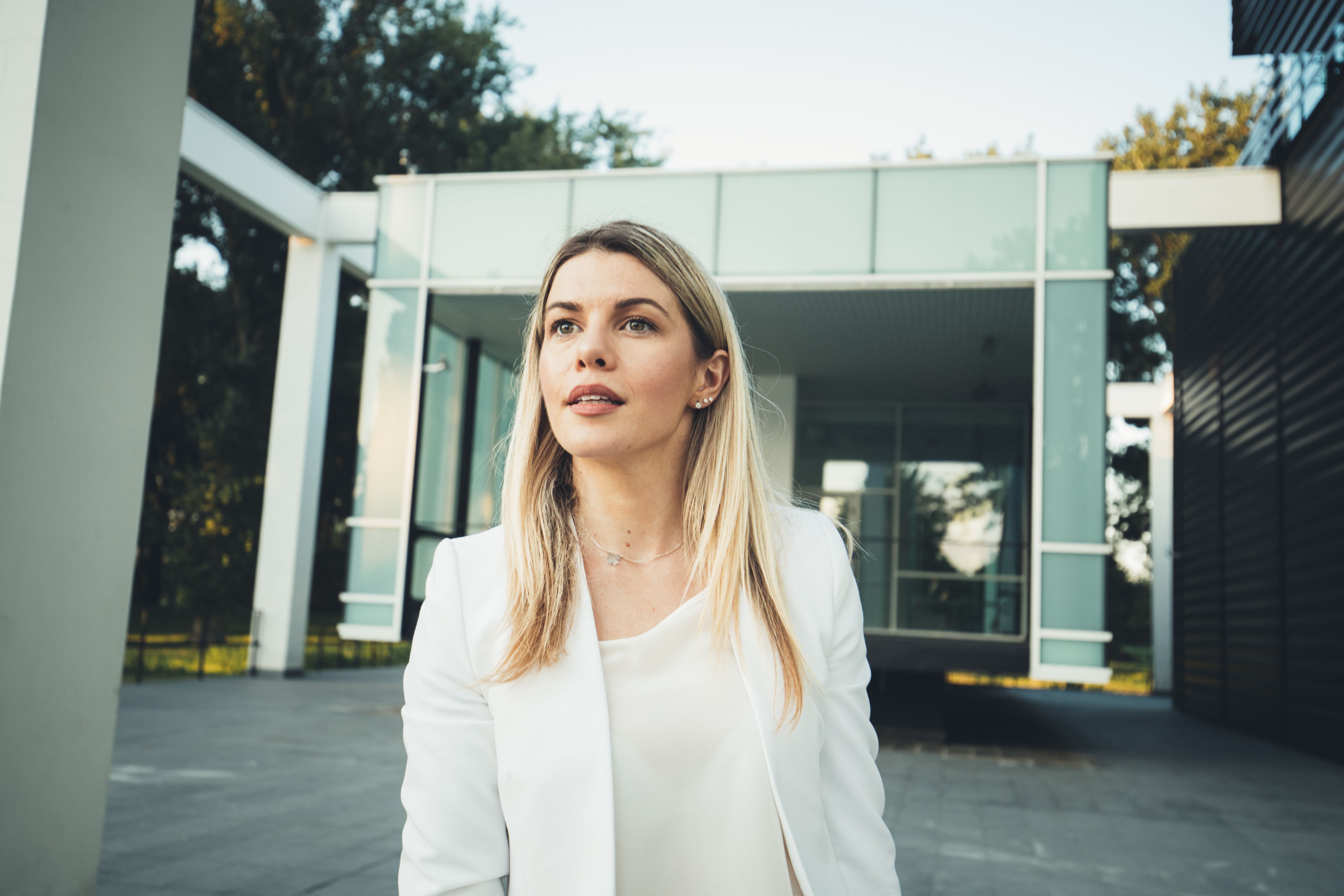 A young businesswoman in front of an office building A young businesswoman in front of an office building
