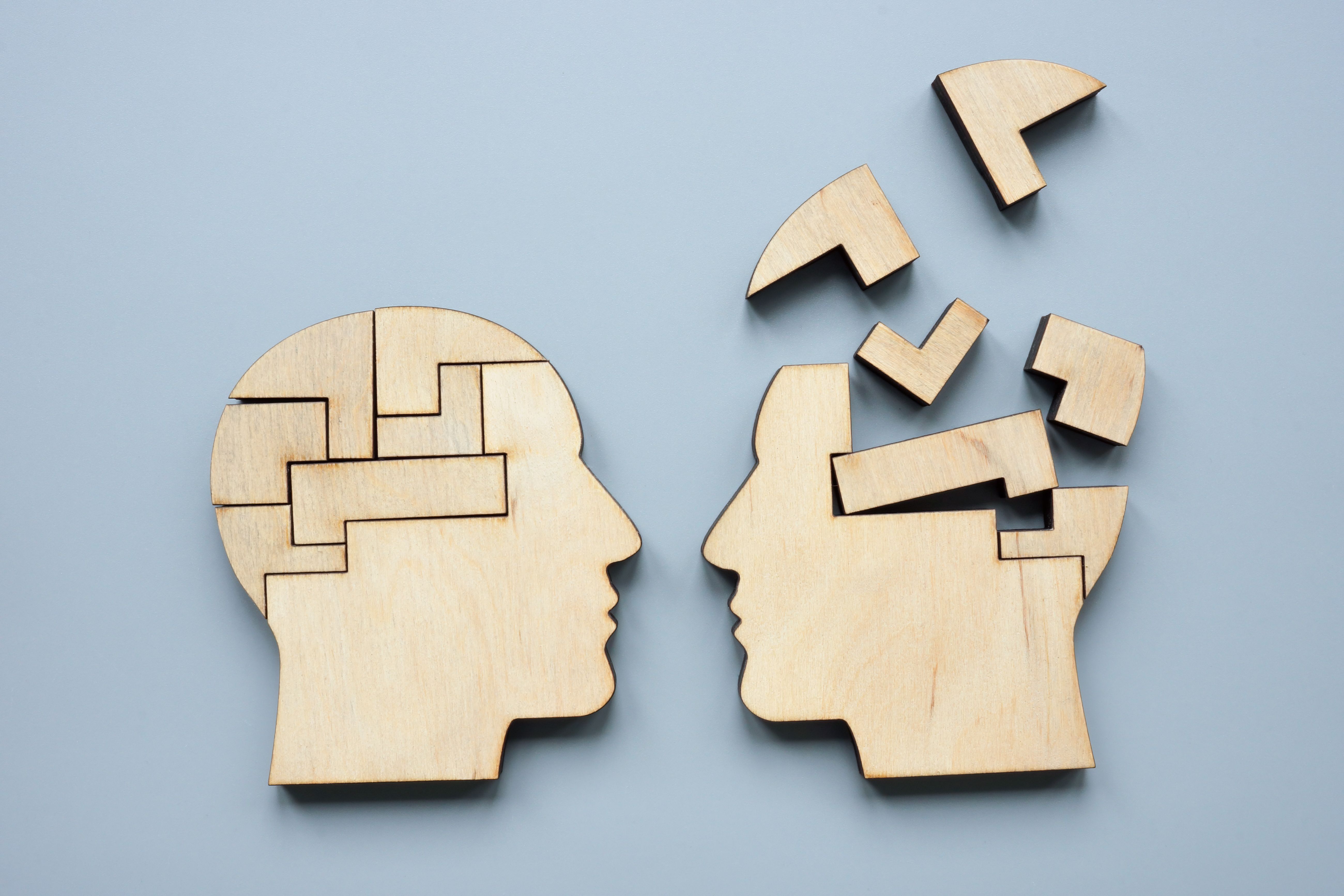 A head assembled from puzzles and disassembled as a symbol of mentoring and psychotherapy. A head assembled from puzzles and disassembled as a symbol of mentoring and psychotherapy.