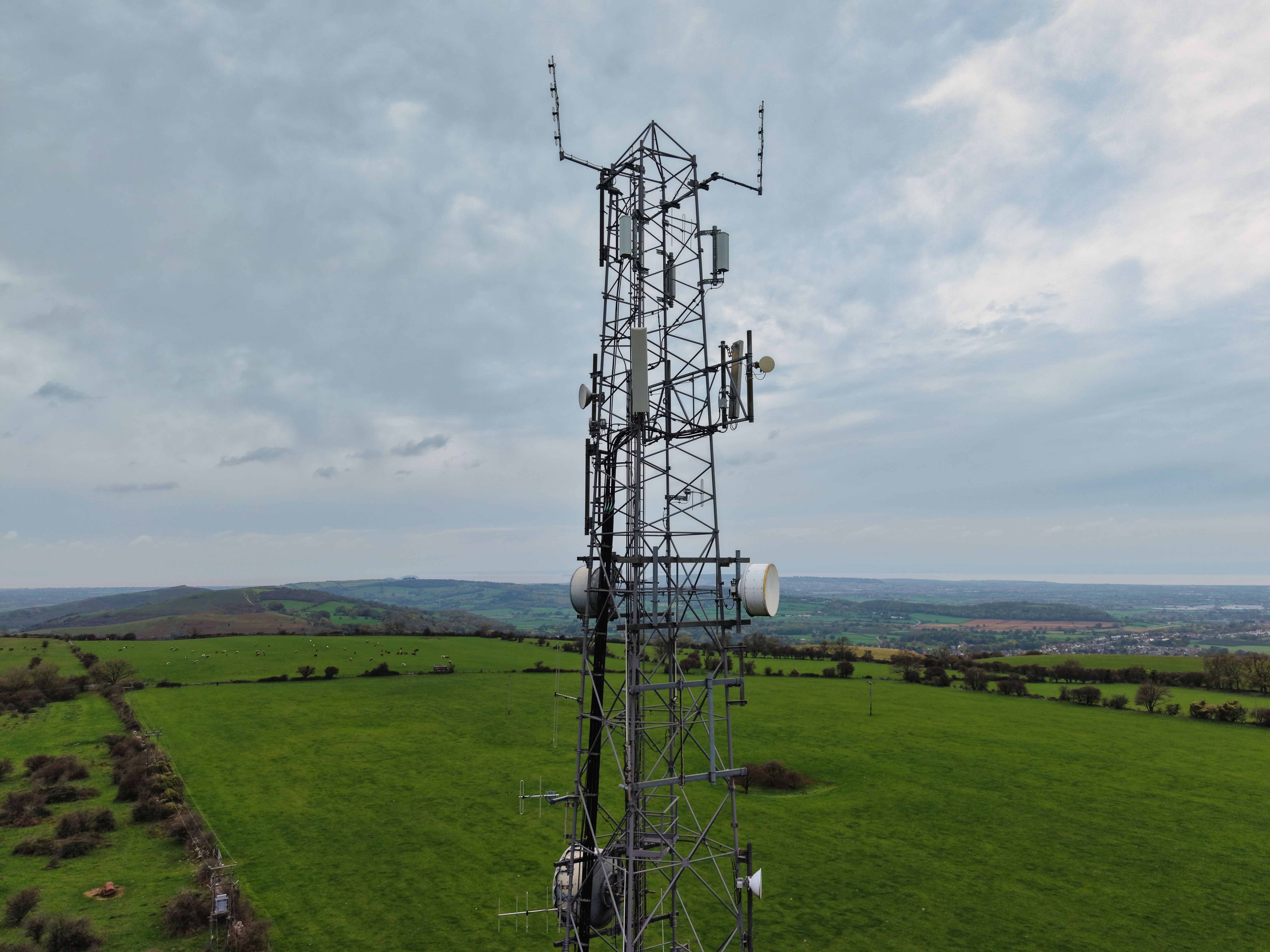 Aerial View of a Telecommunications Tower in the British Suburban Landscape Aerial View of a Telecommunications Tower in the British Suburban Landscape