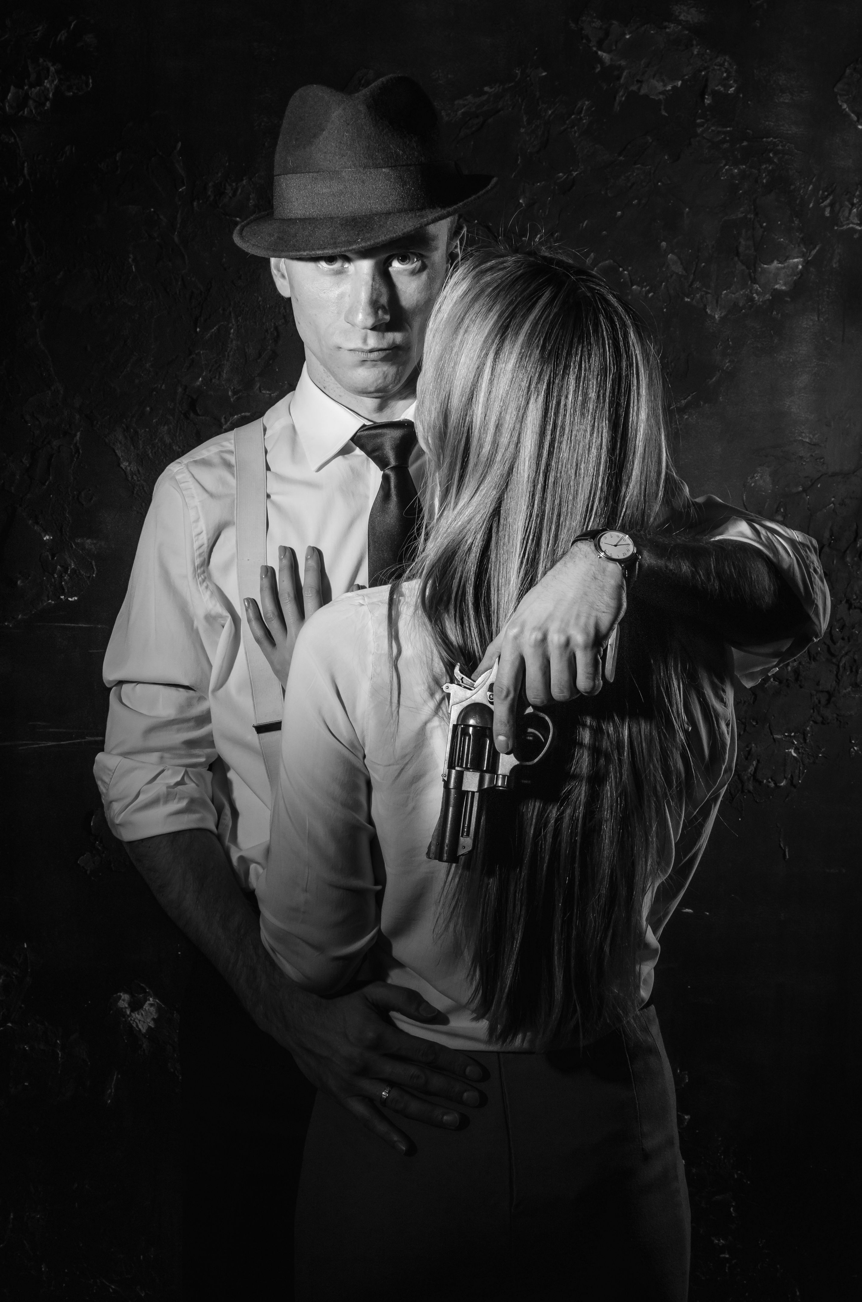 Detective with beautiful woman in black and white, noir style
