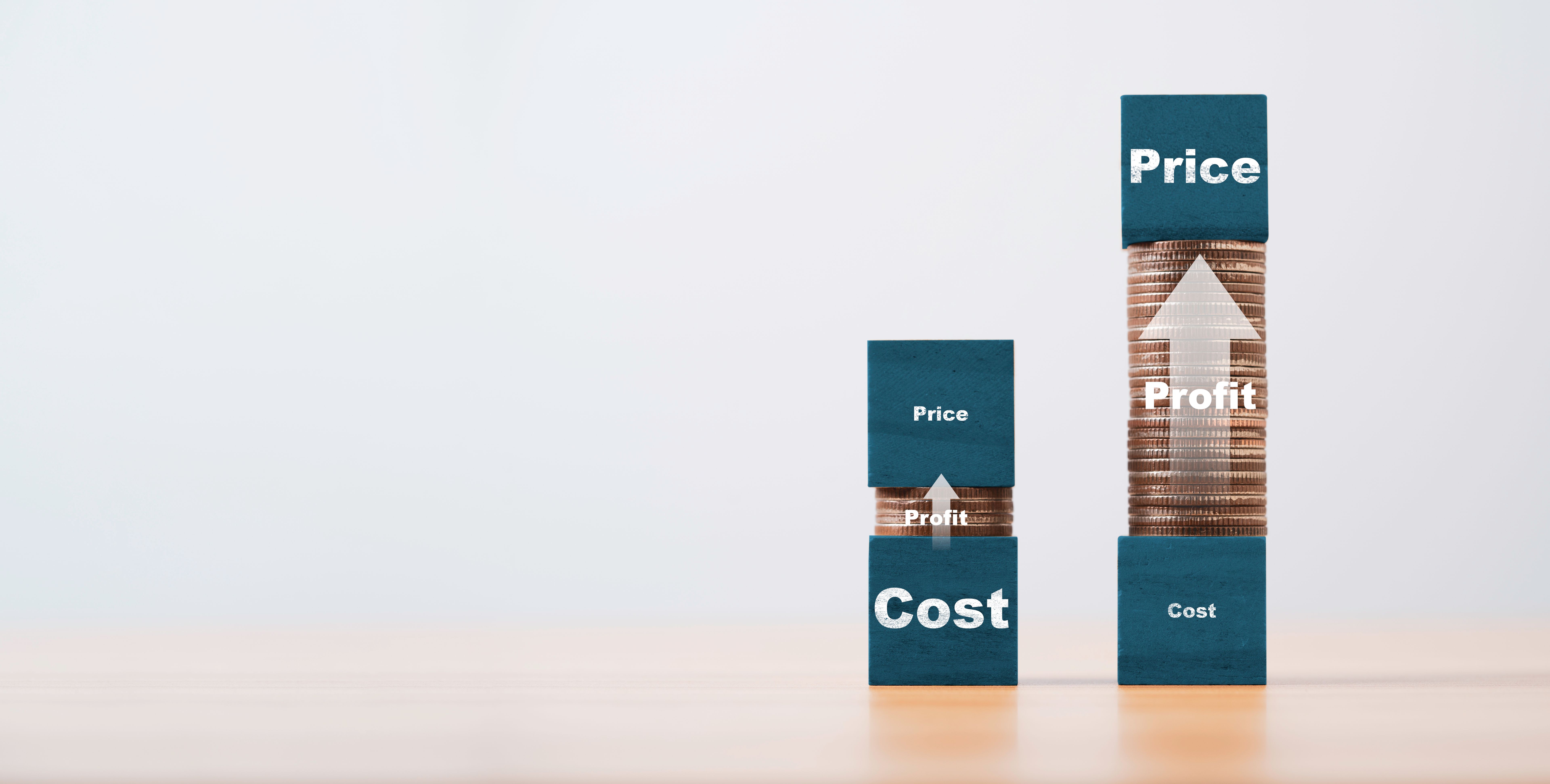 Price and cost print screen on blue wooden block cube with high and low coins stacking for business investment profit concept.