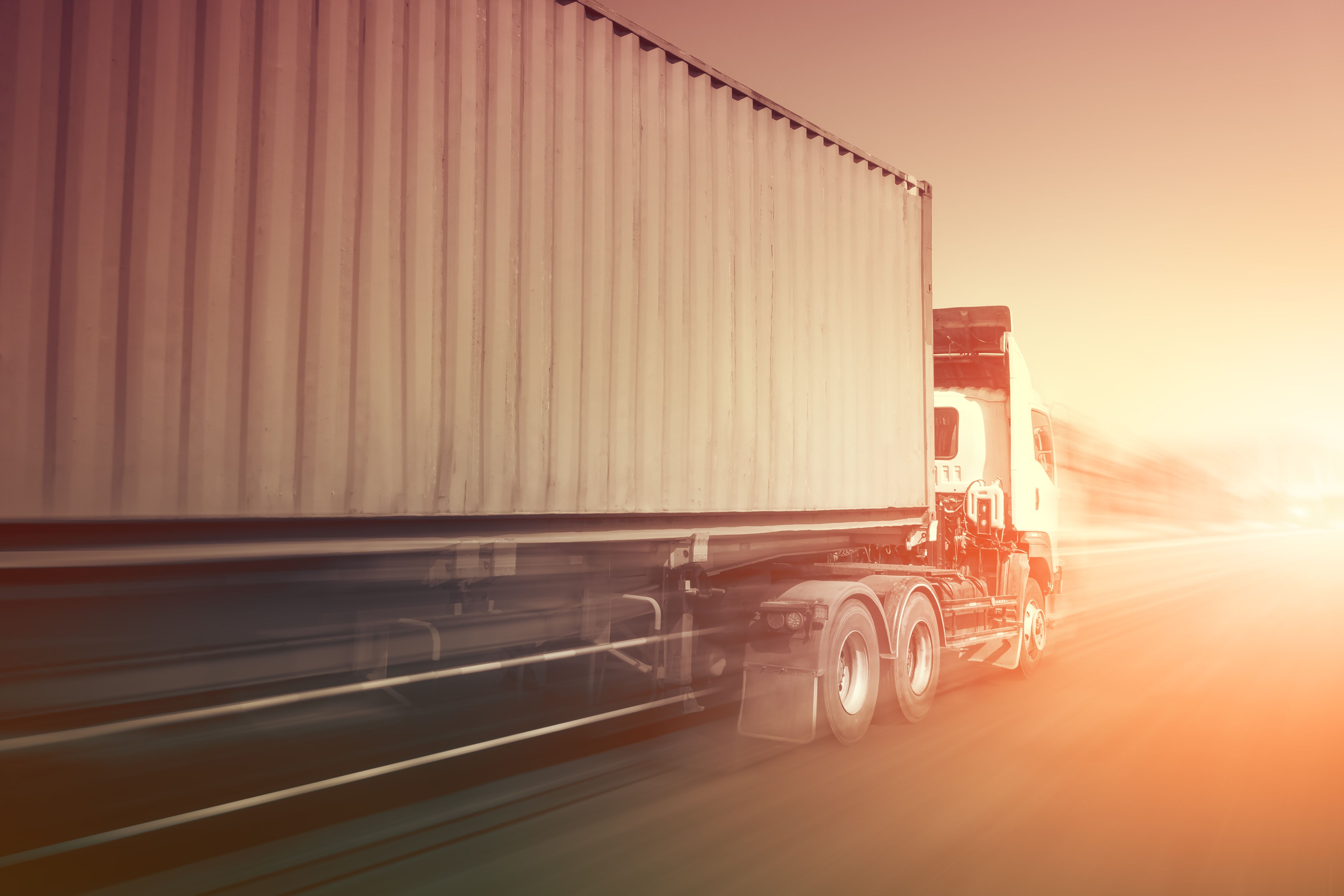 Speed Motion of Semi Trailer Truck Driving on The Road. Shipping Cargo Container. Economical Transportation Business. Economy Business Transport on Road. Trucking. Freight Logistics