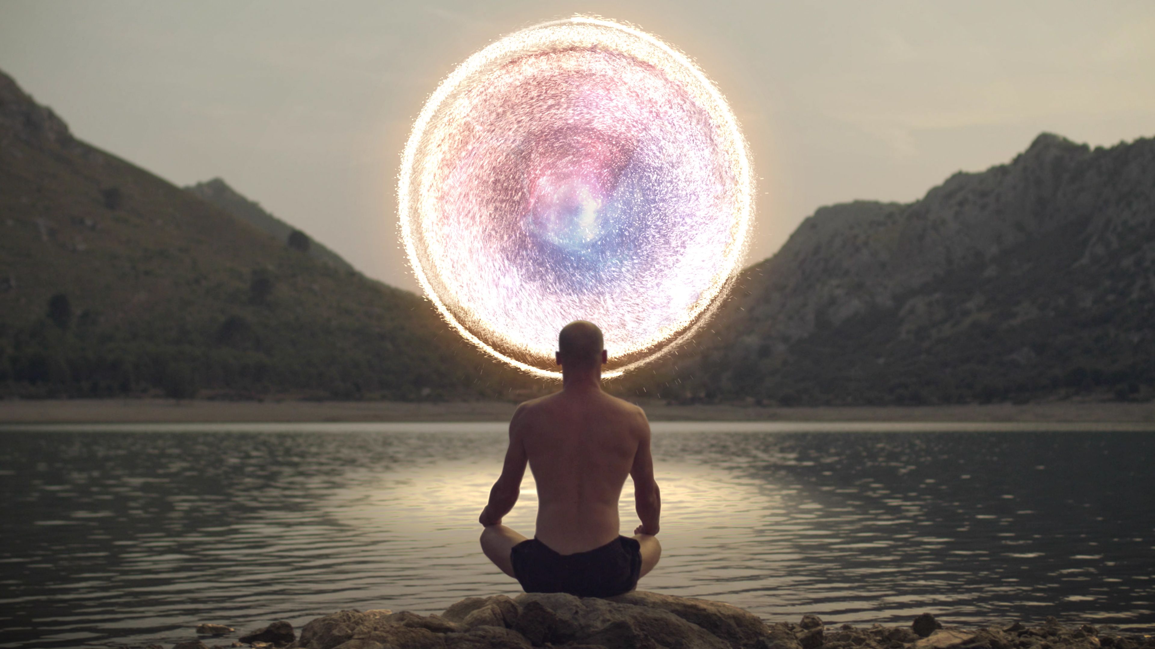 Meditating man opening portal to cosmic energy. Meditating man opening portal to cosmic energy.