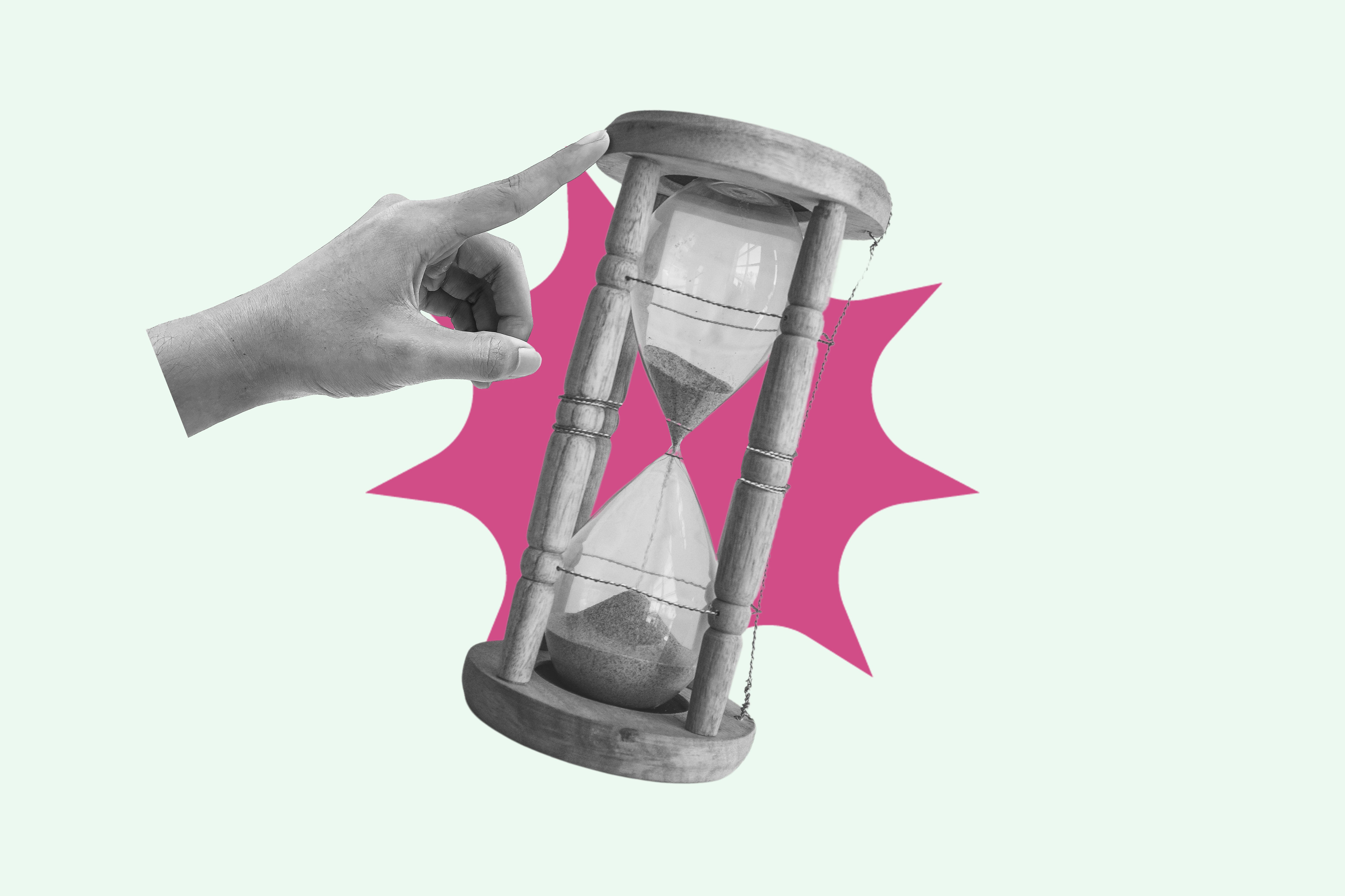 Hand pointing and pushing hourglass with sand falling, running out of time concept Hand pointing and pushing hourglass with sand falling, running out of time concept