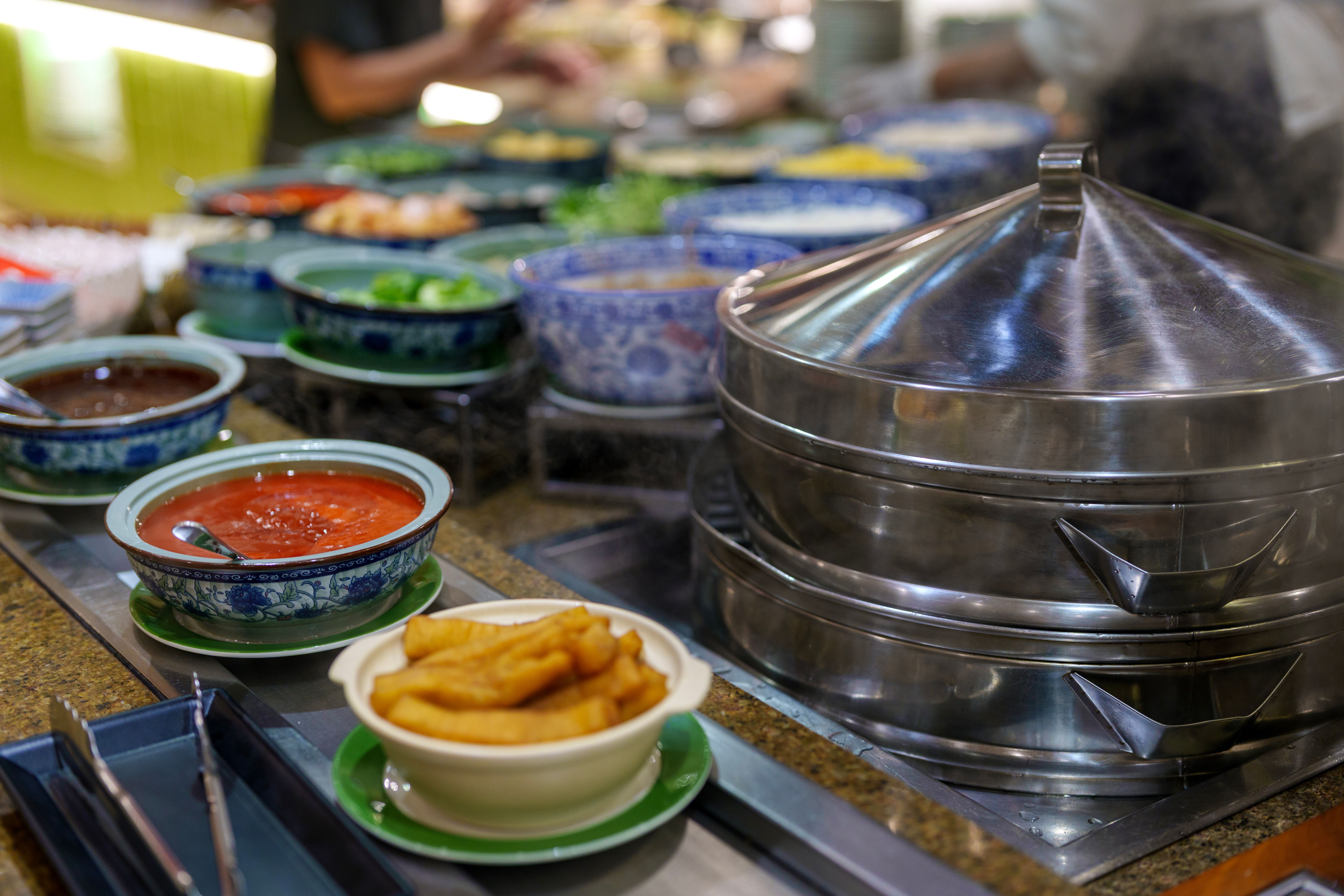 Asian Condiments and Steamer at Hotel Buffet