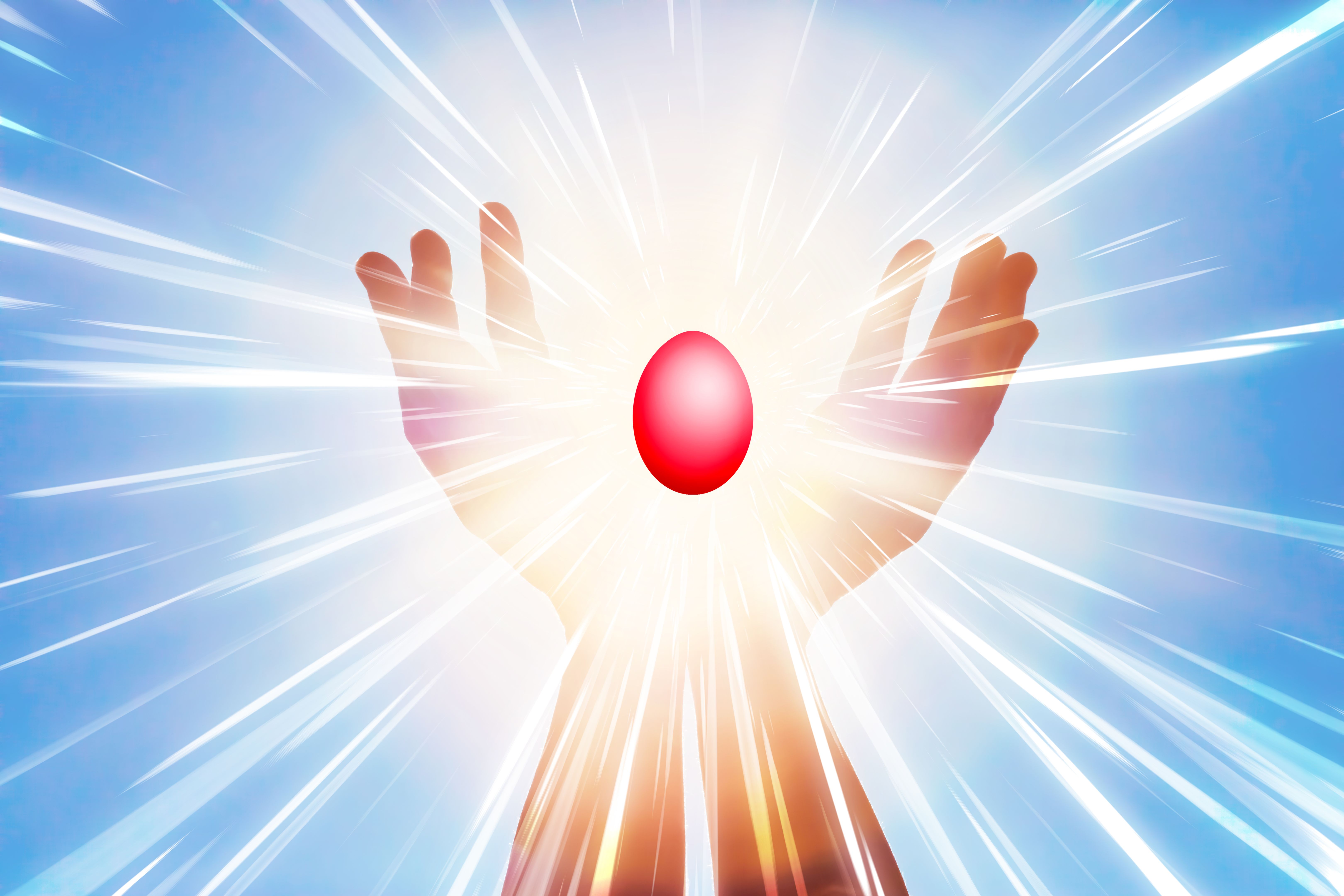 Happy Easter greeting - raised hands holding an Easter egg