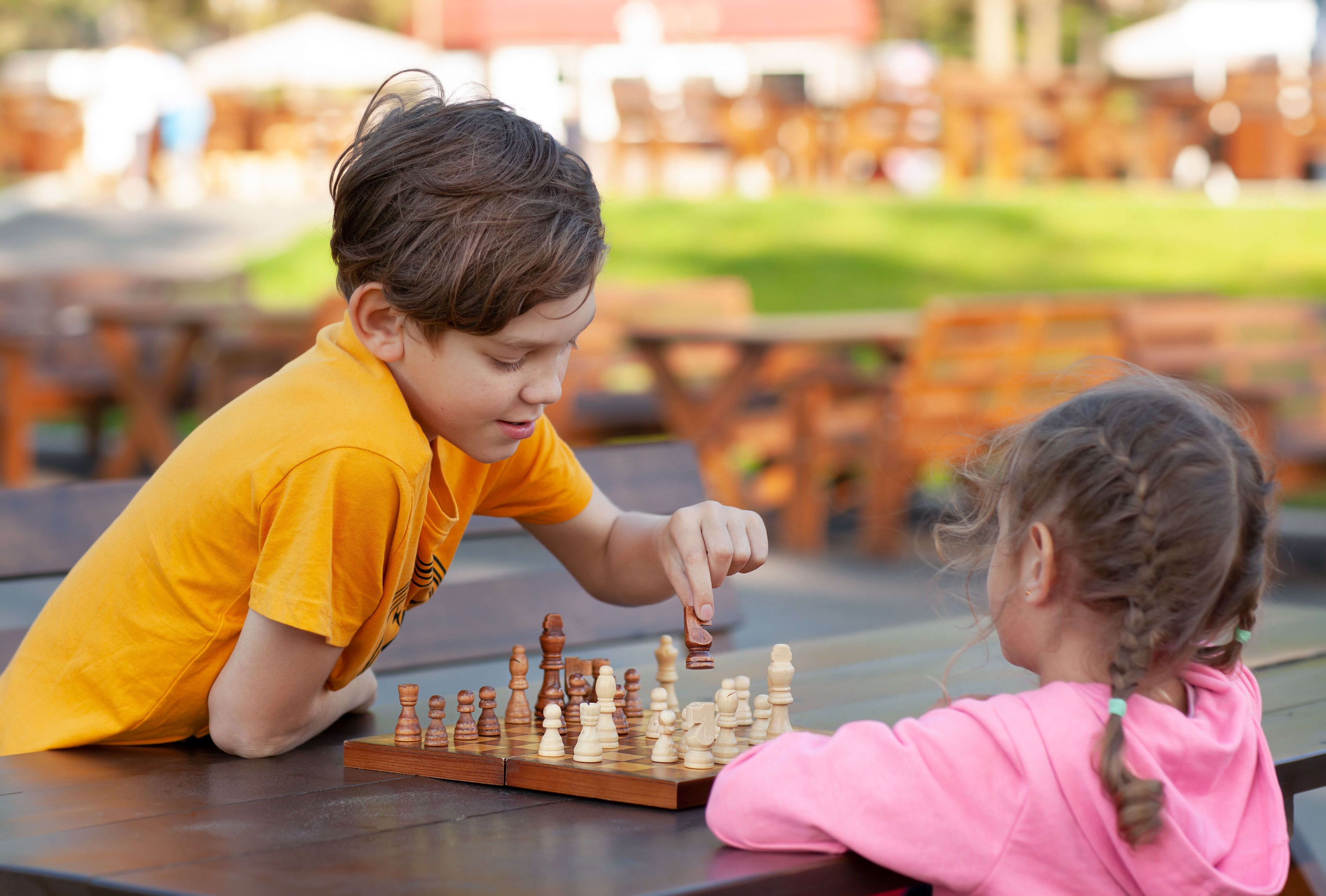 children socializing chess