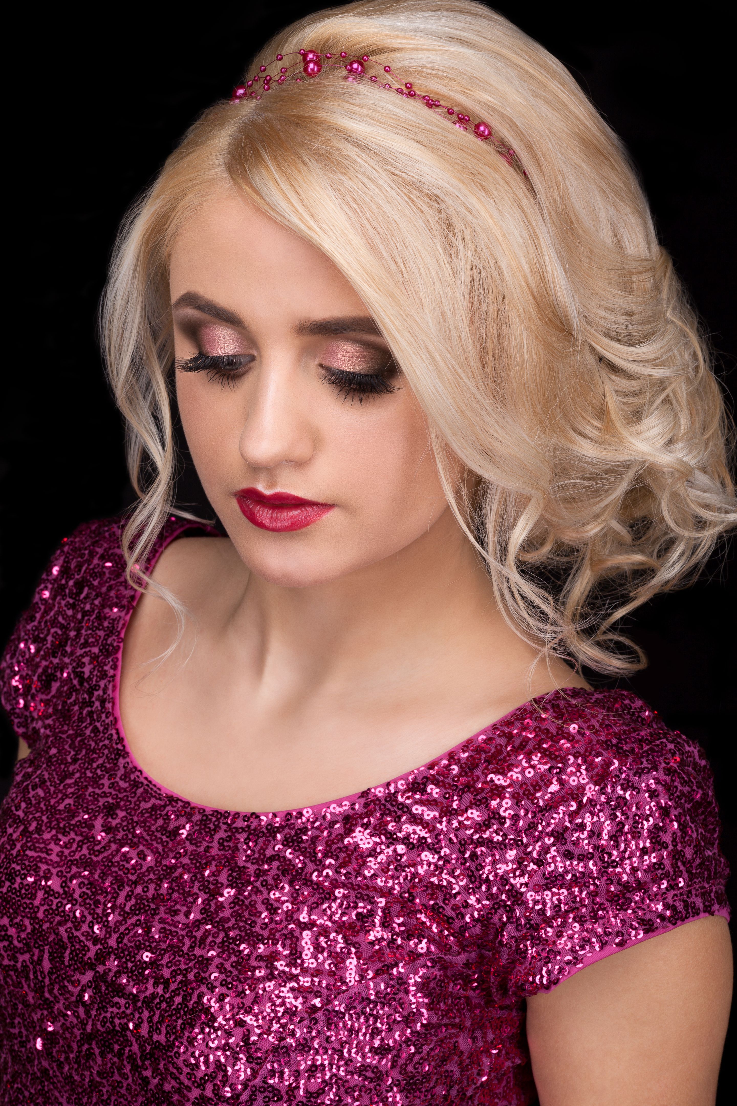 Portrait of the blonde on a black background