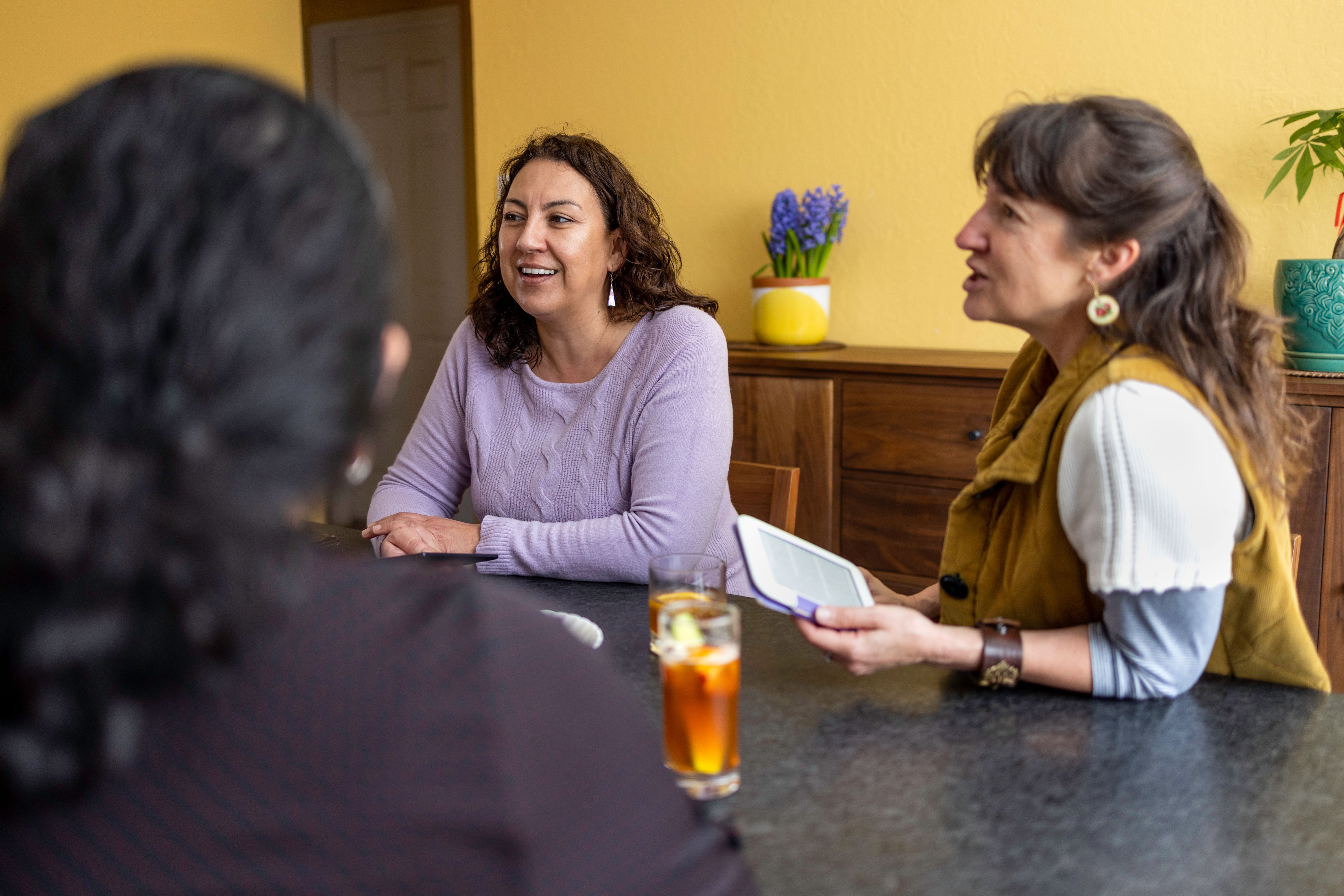 women sharing stories