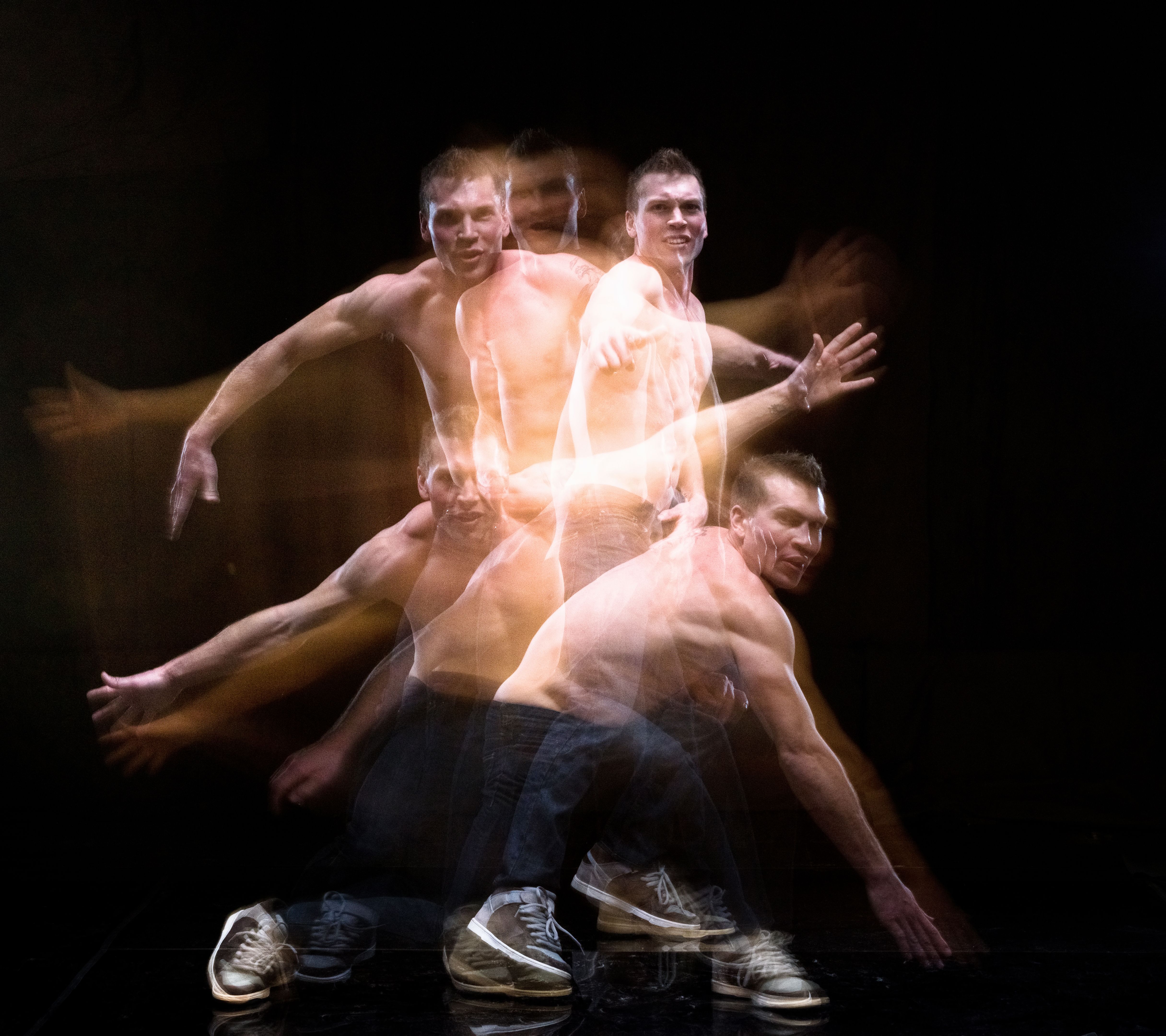 Shirtless man moving around with motion blur Shirtless man moving around with motion blur