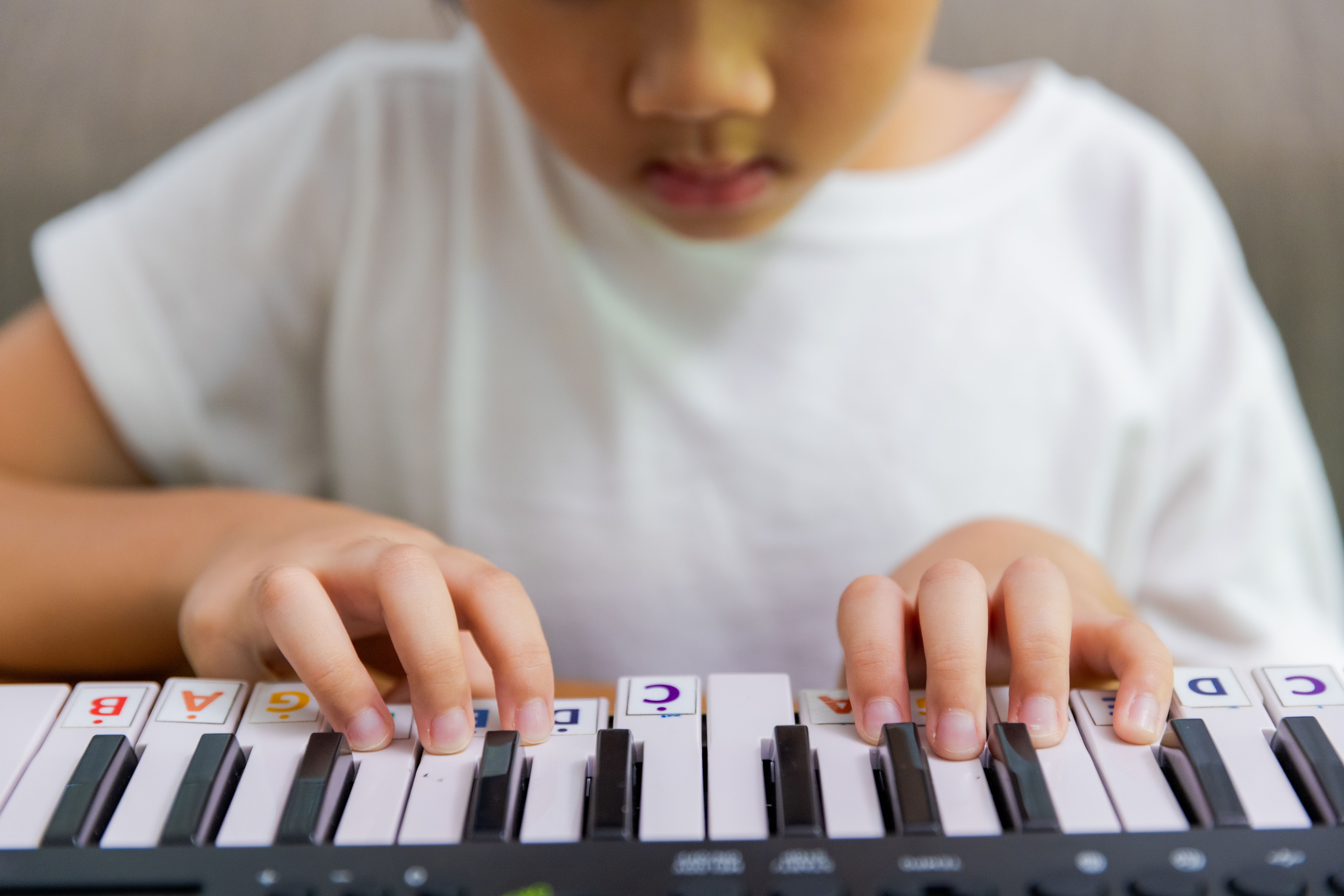 children practicing piano