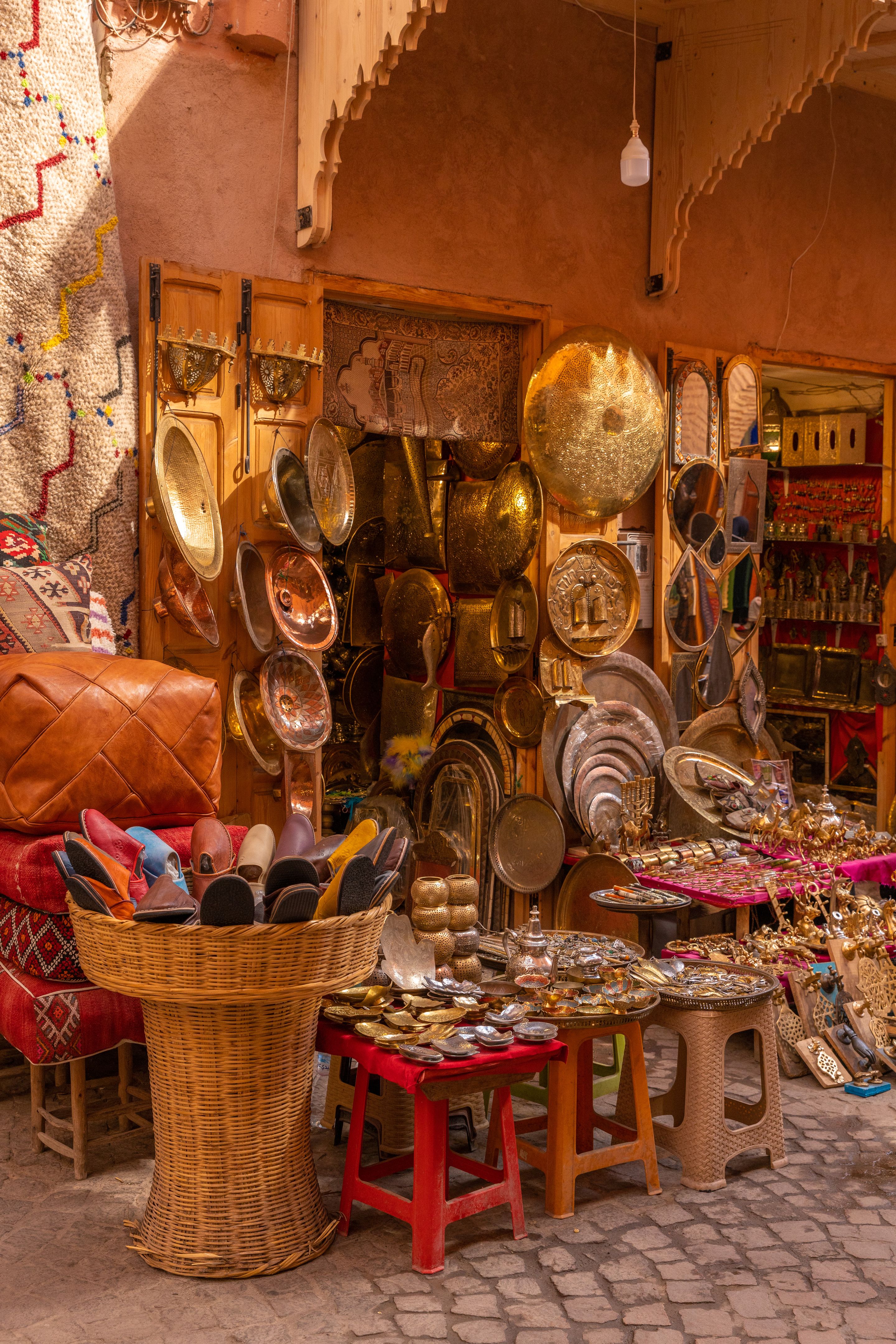 Marrakech Bazaar Stalls with Moroccan Souvenirs and antiques at Medina Souk market Marrakech Bazaar Stalls with Moroccan Souvenirs and antiques at Medina Souk market