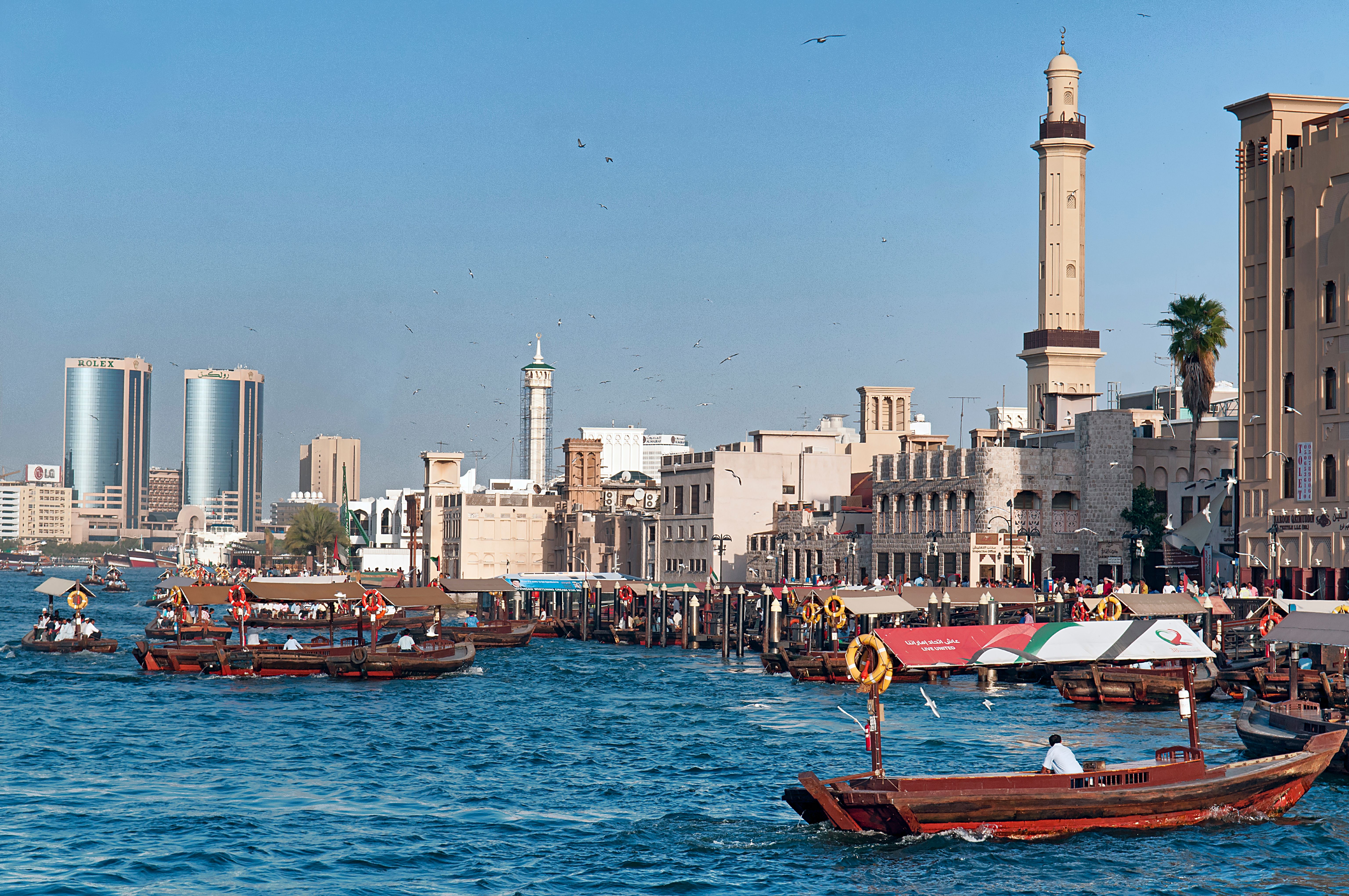 Peolple on traditional abra ferries, Dubai