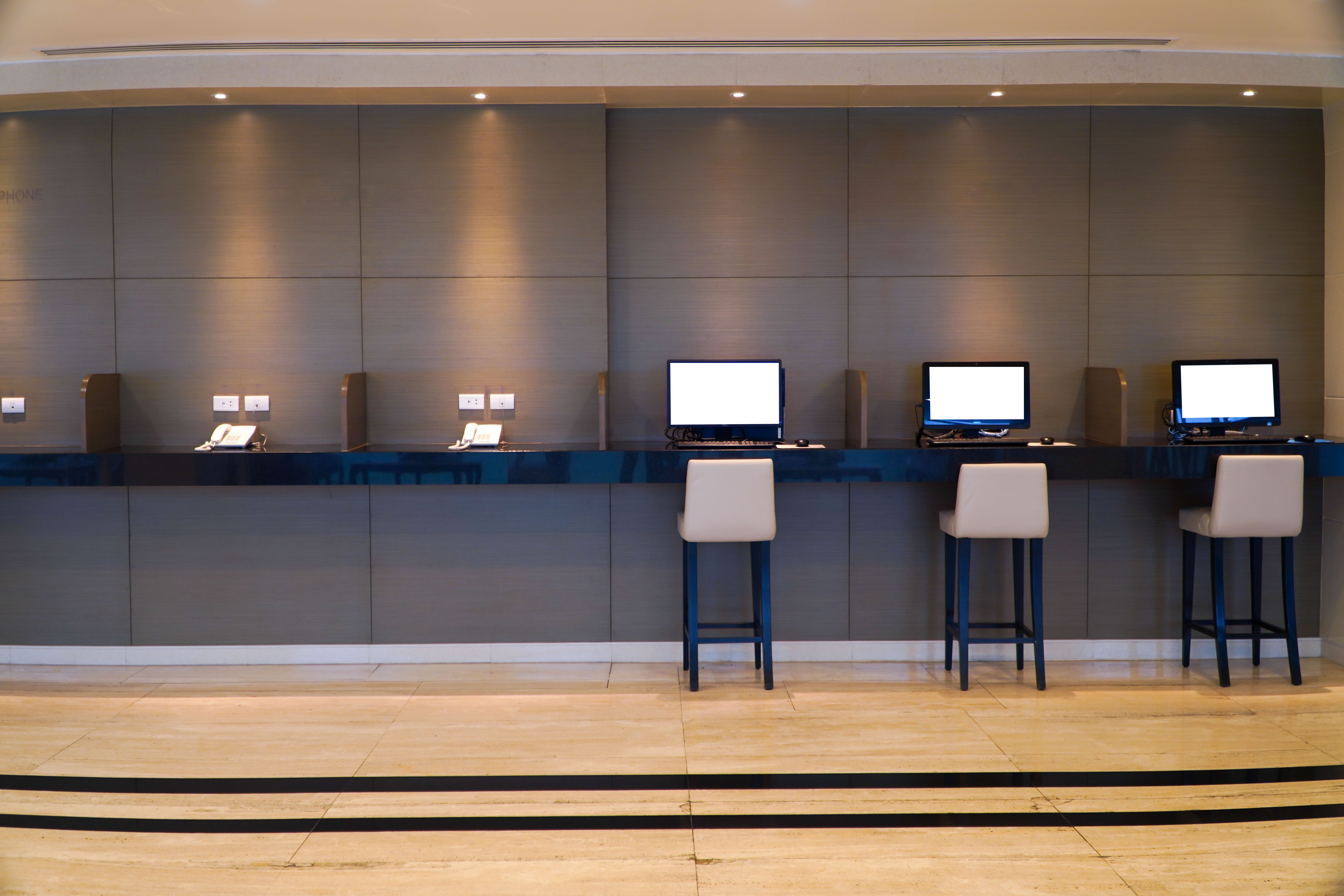 Hotel interior with rows of computer monitors and seats,Lounge design concept for customers