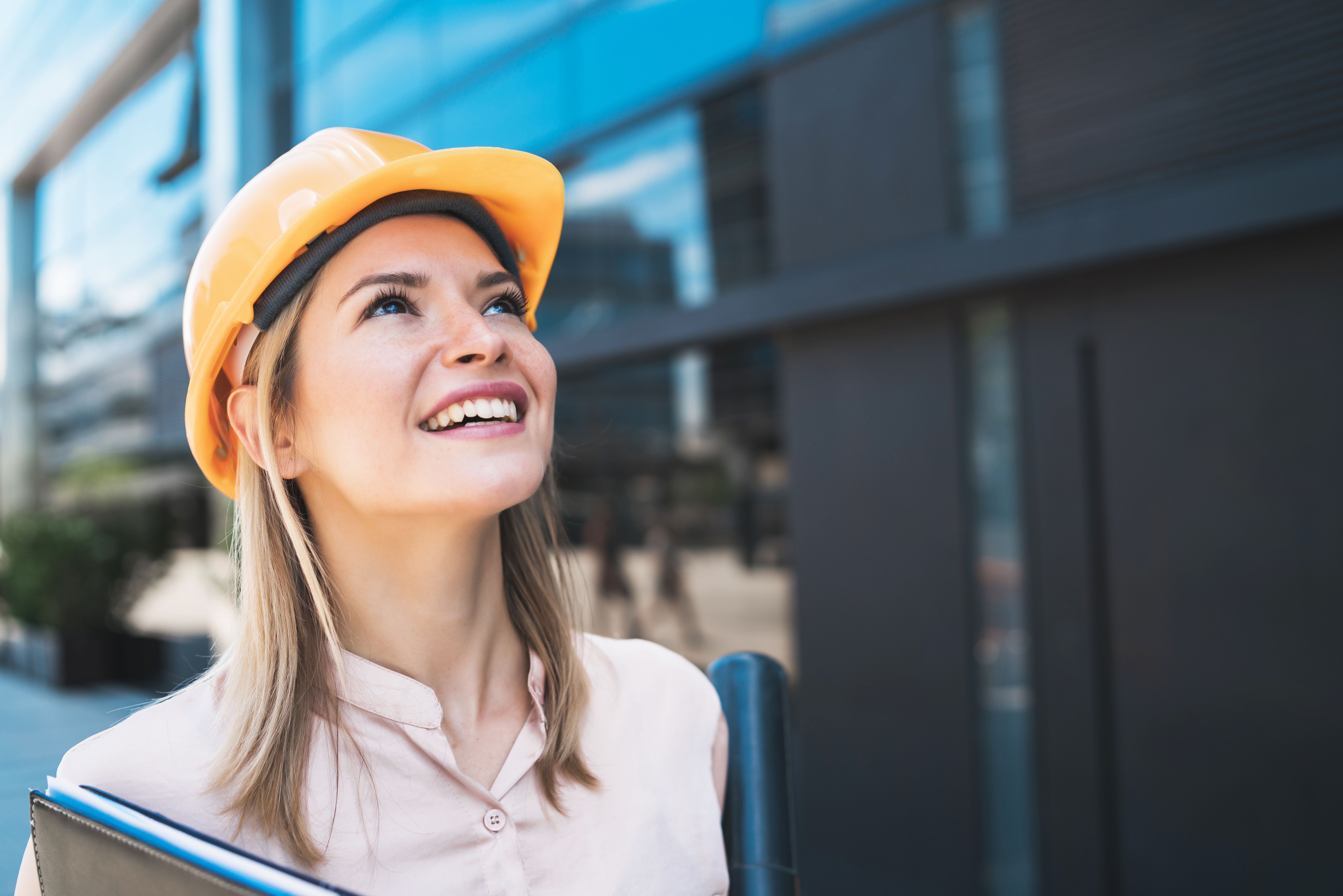 Professional architect woman standing outdoors. Professional architect woman standing outdoors.