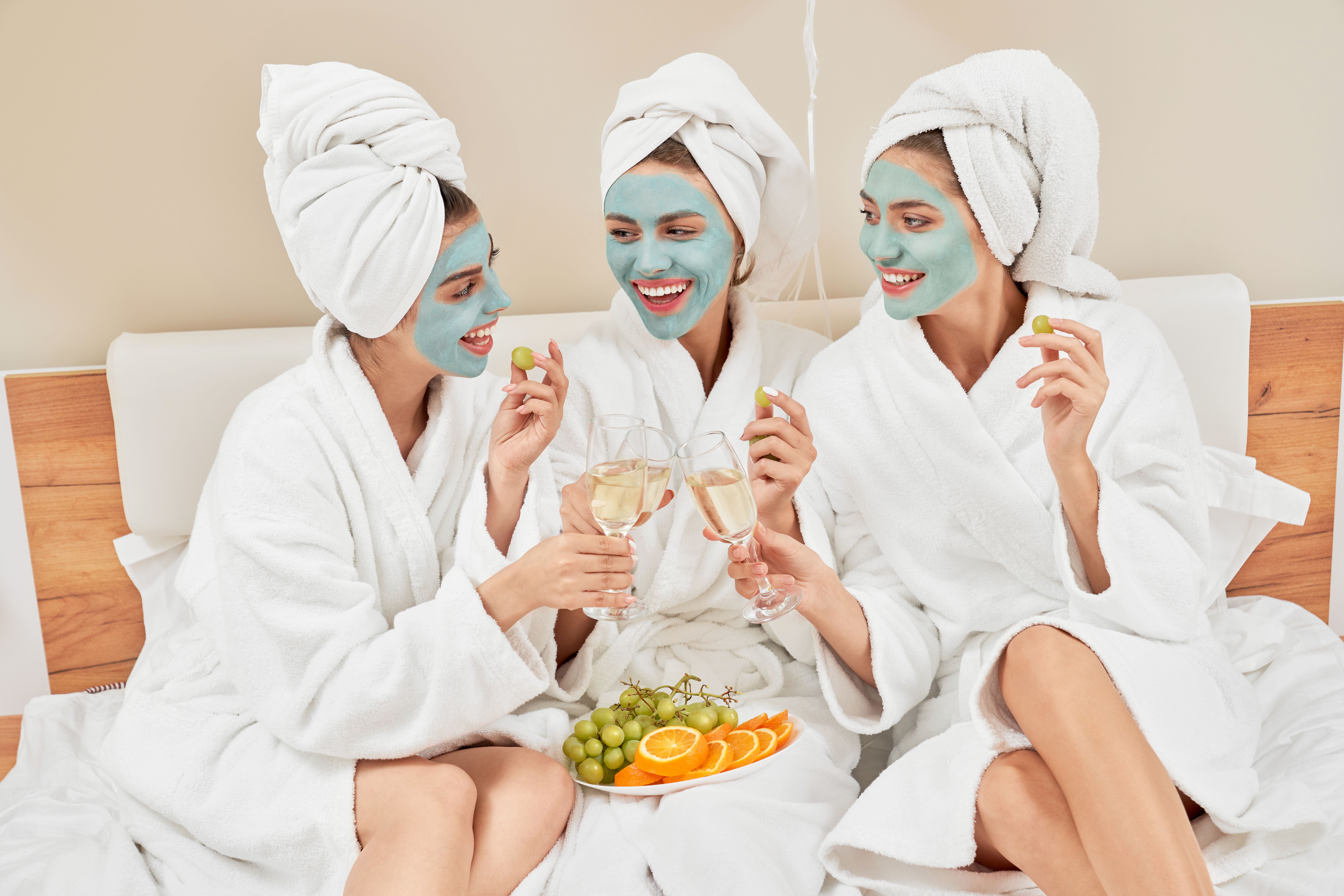 Girls with hydrogel masks with champagne & wellness vacation weekend getaway