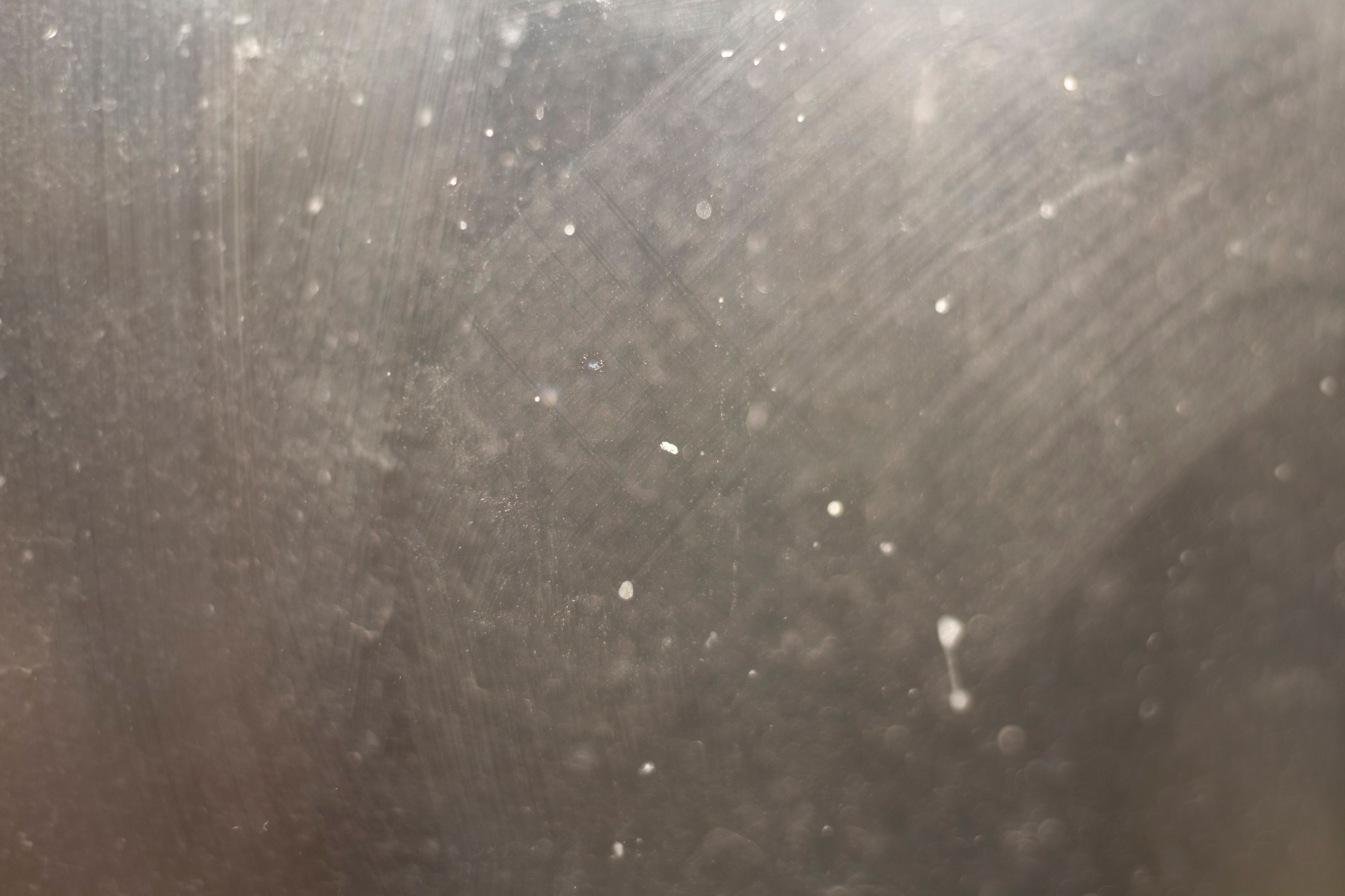 Dirt on glass. Texture of cloudy glass. Dusty window.