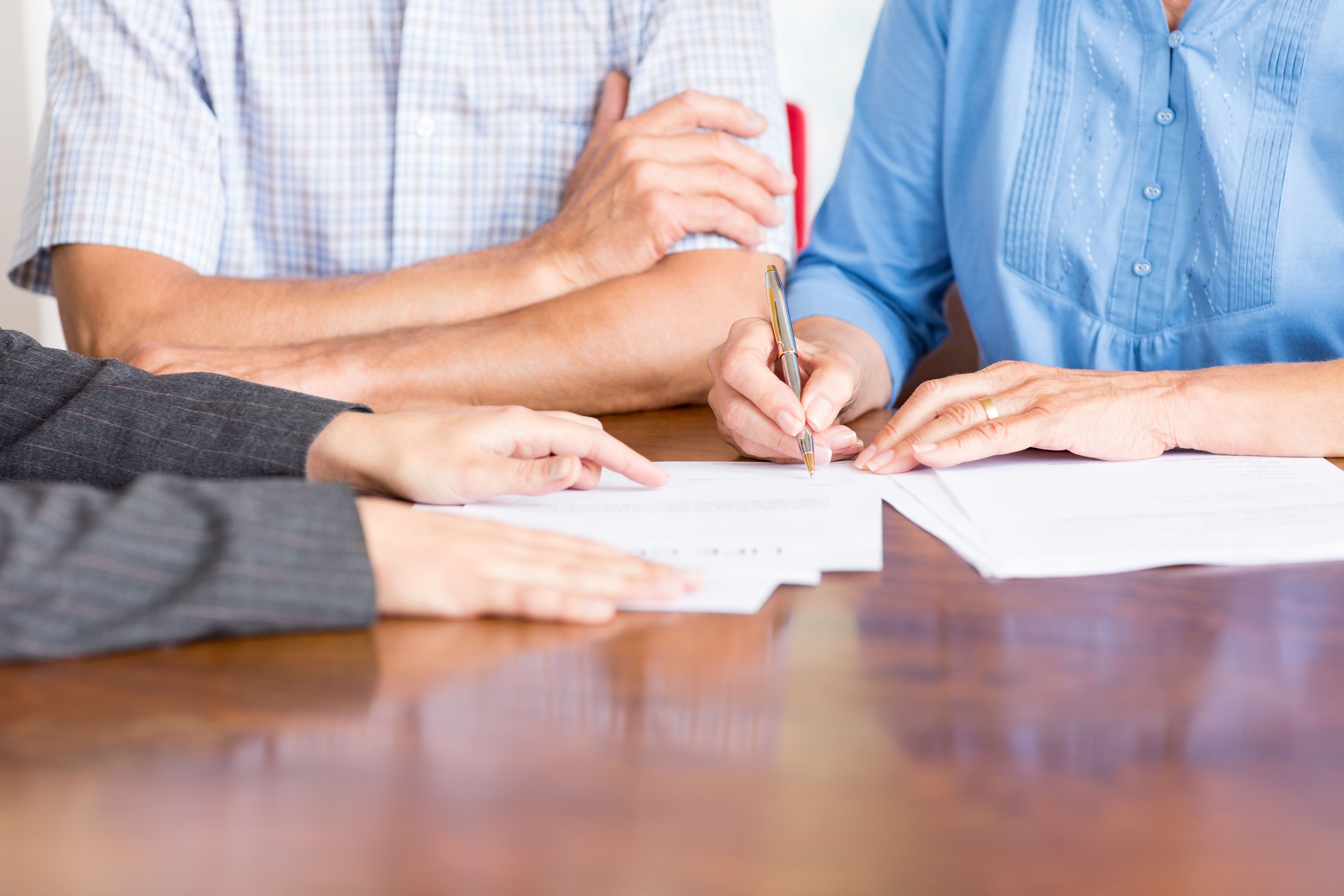 couple signing papers