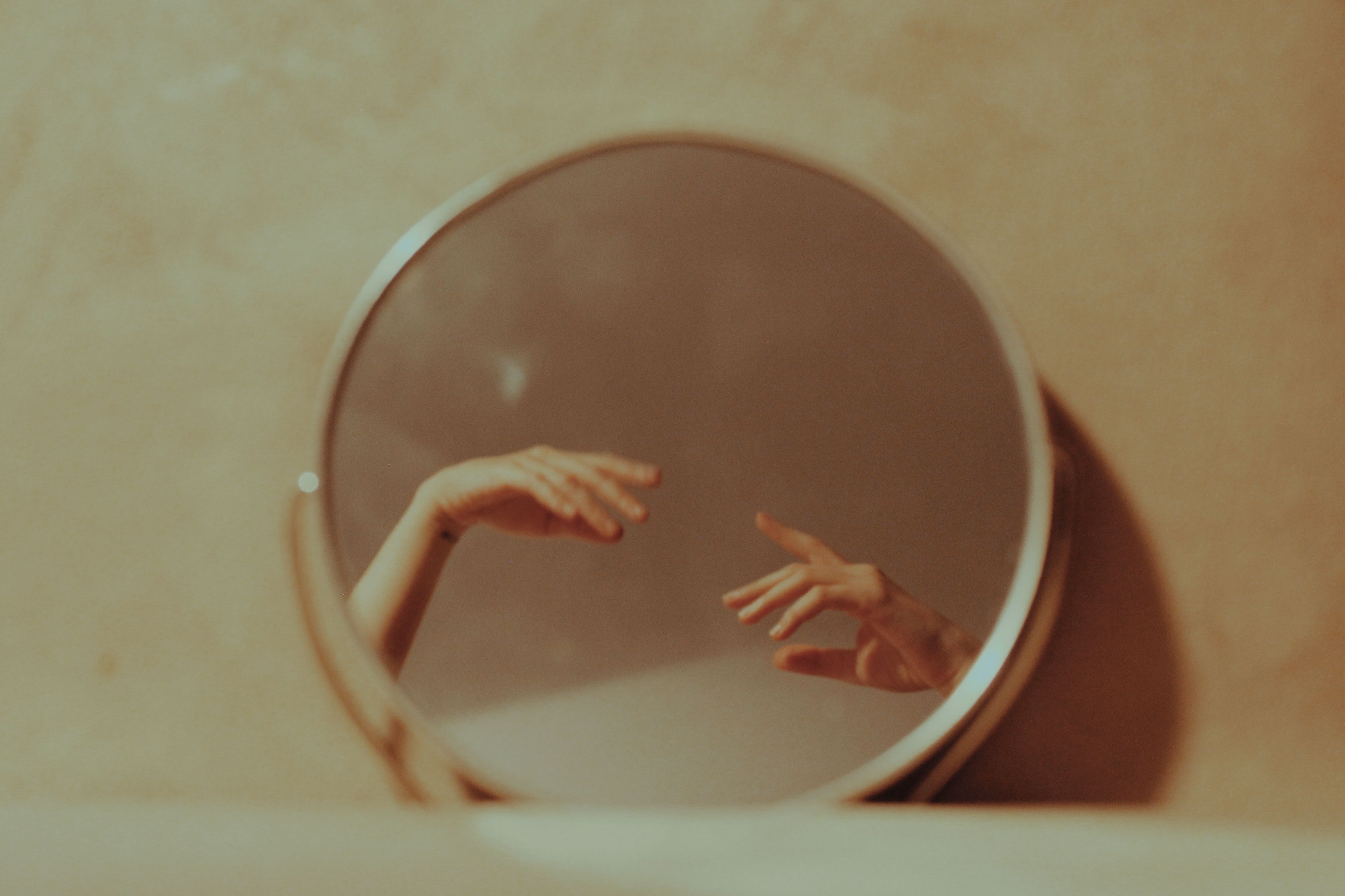 Reflection Of Woman Hands In Vanity Mirror At Home