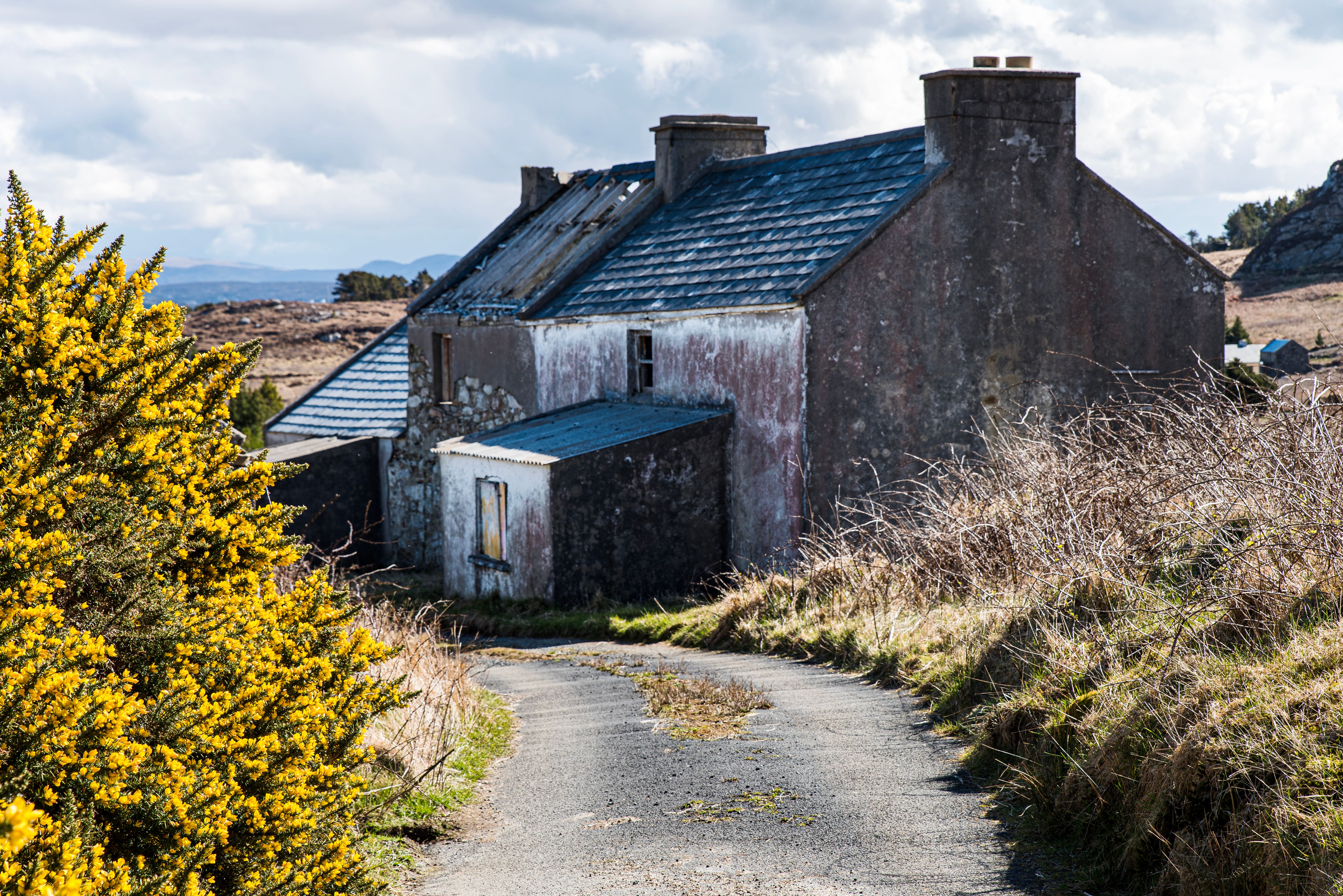 Abandoned property or house on Arranmore island, Republic of Ireland County Donegal. Derelict or destitute home shows Irish rural depopulation problem - Arranmore island, County Donegal, Republic of Ireland