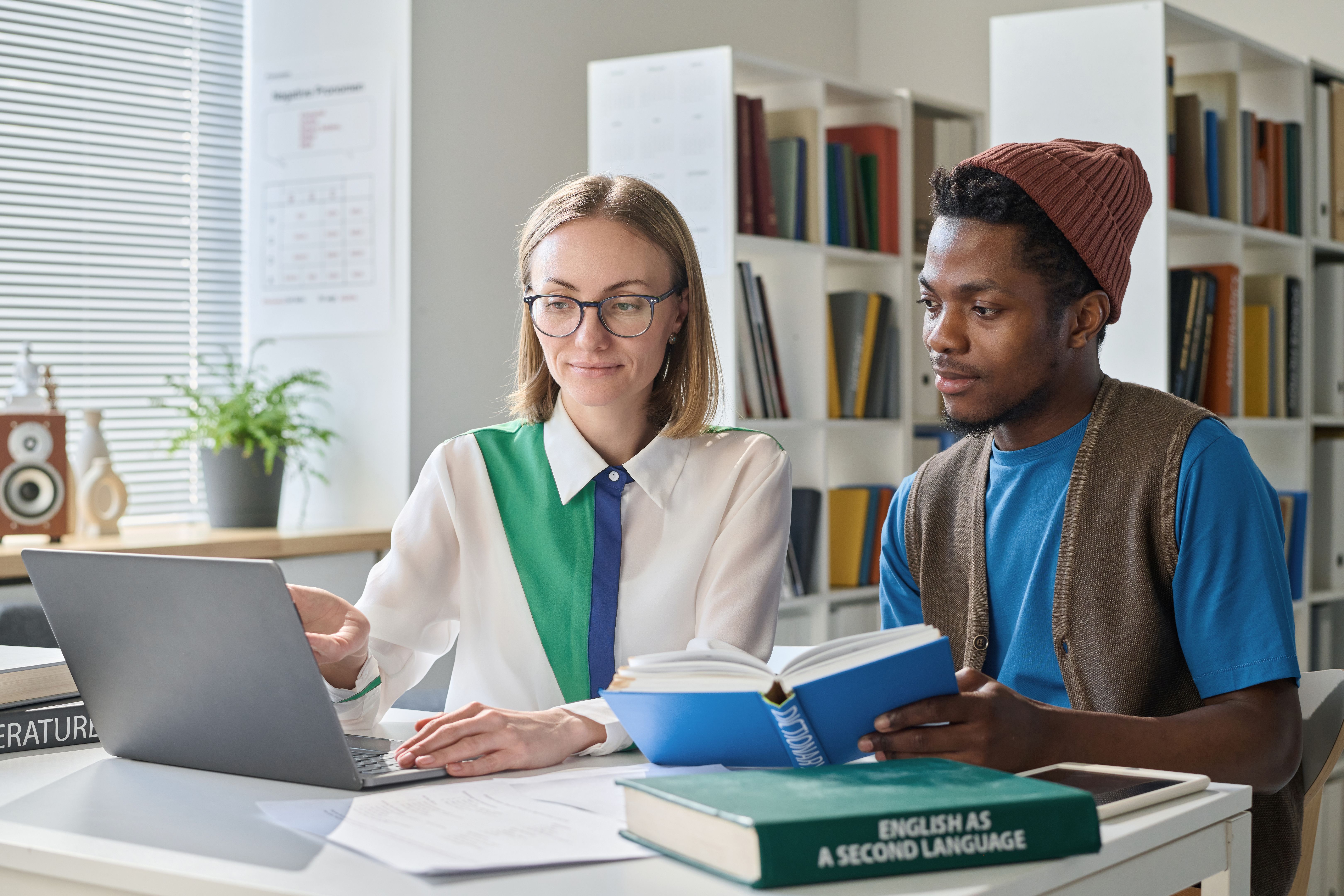 Student having personal lesson with teacher Student having personal lesson with teacher