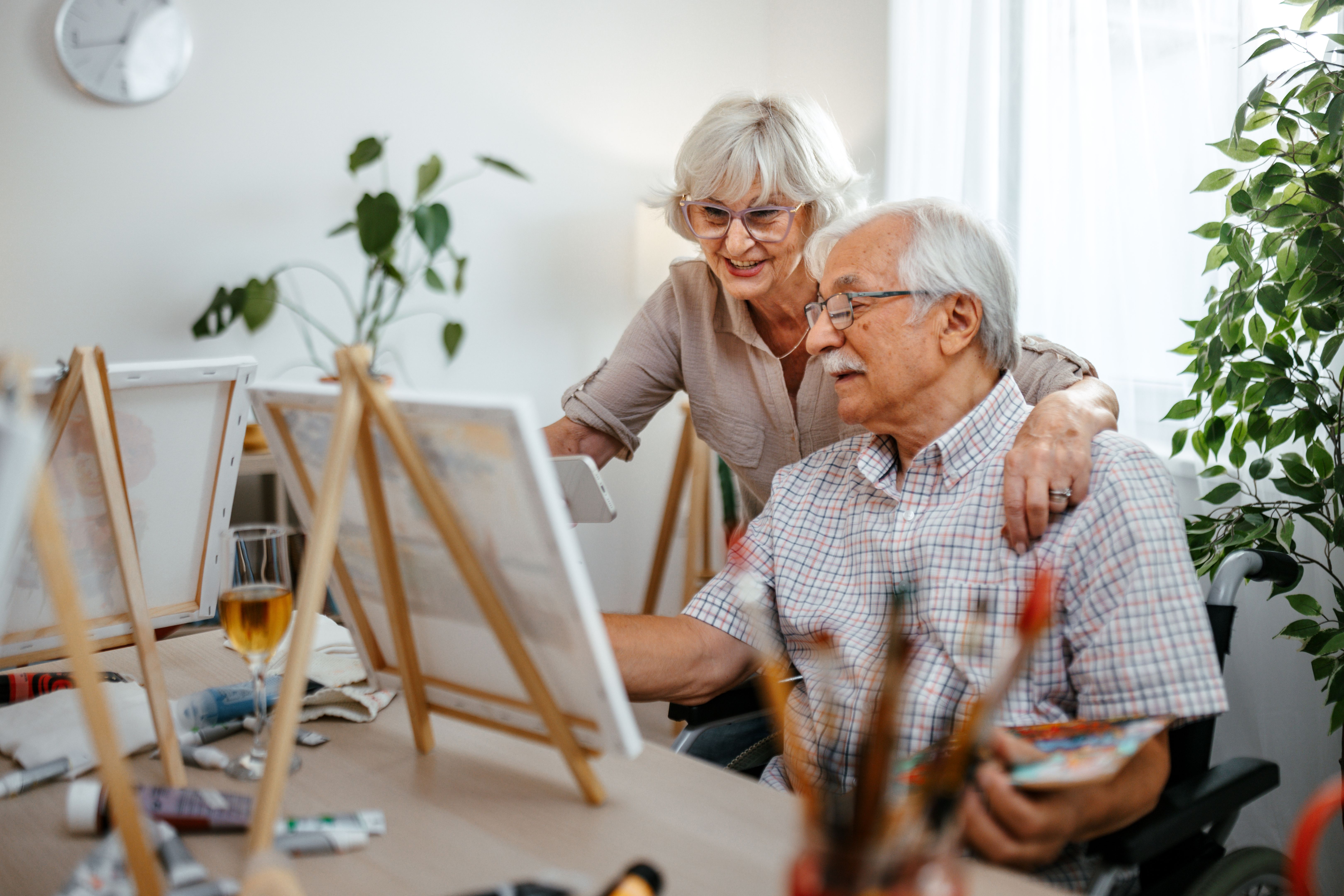 Senior couple painting together at home Senior couple painting together at home